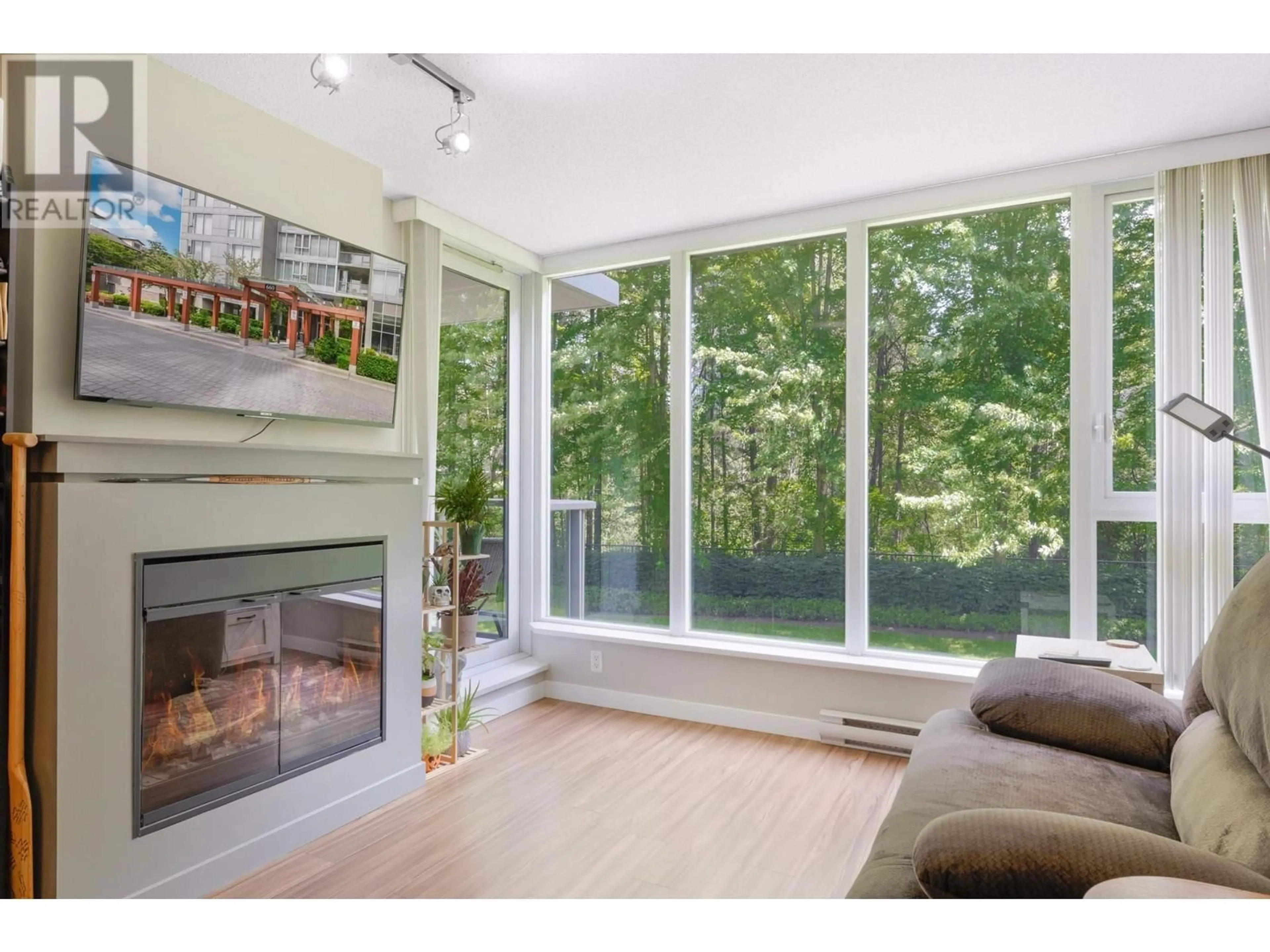 A pic of a room, wood floors for 309 660 NOOTKA WAY POINT, Port Moody British Columbia V3H0B7