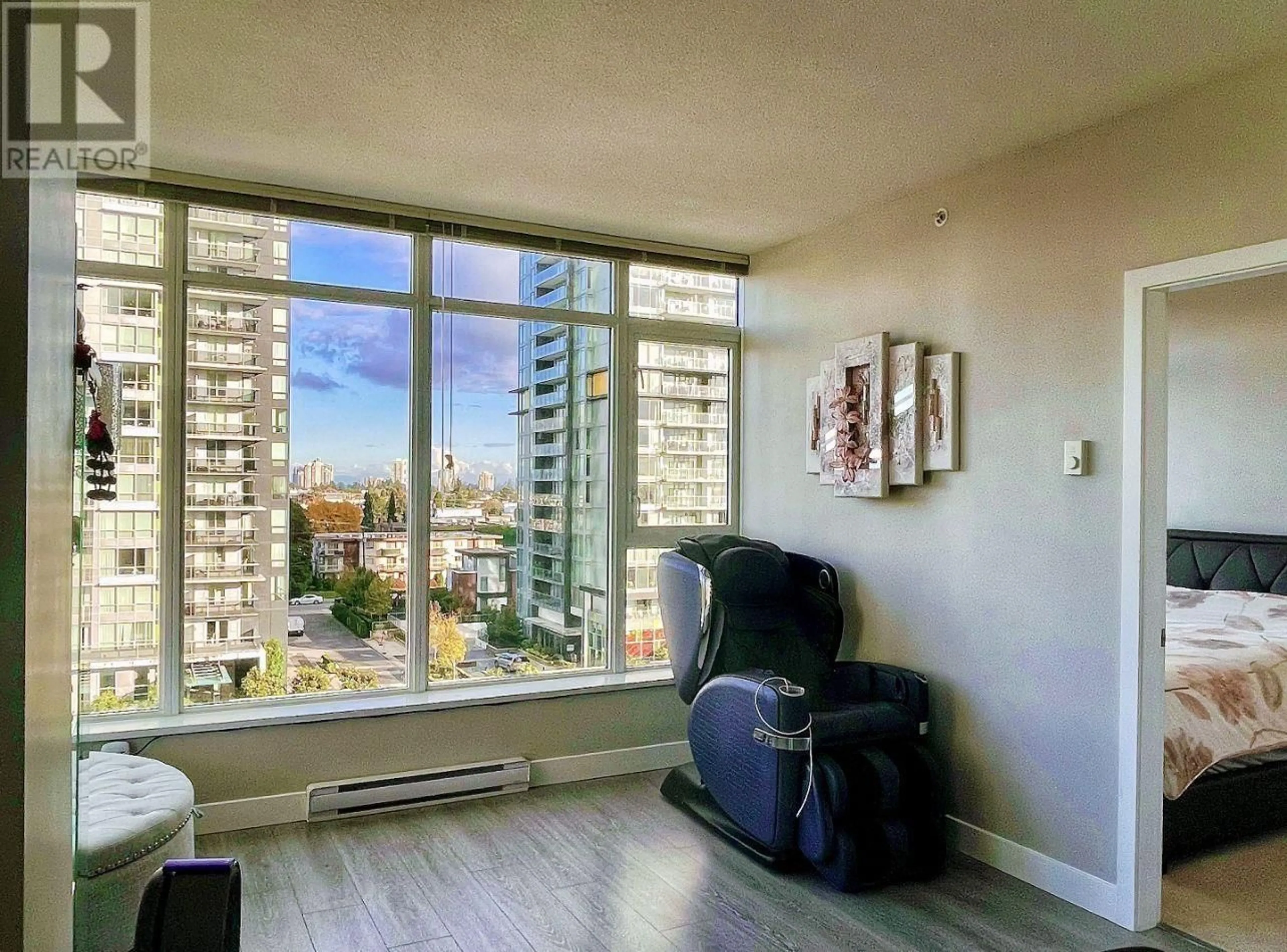 A pic of a room, wood floors for 806 4900 LENNOX LANE, Burnaby British Columbia V5H0G9