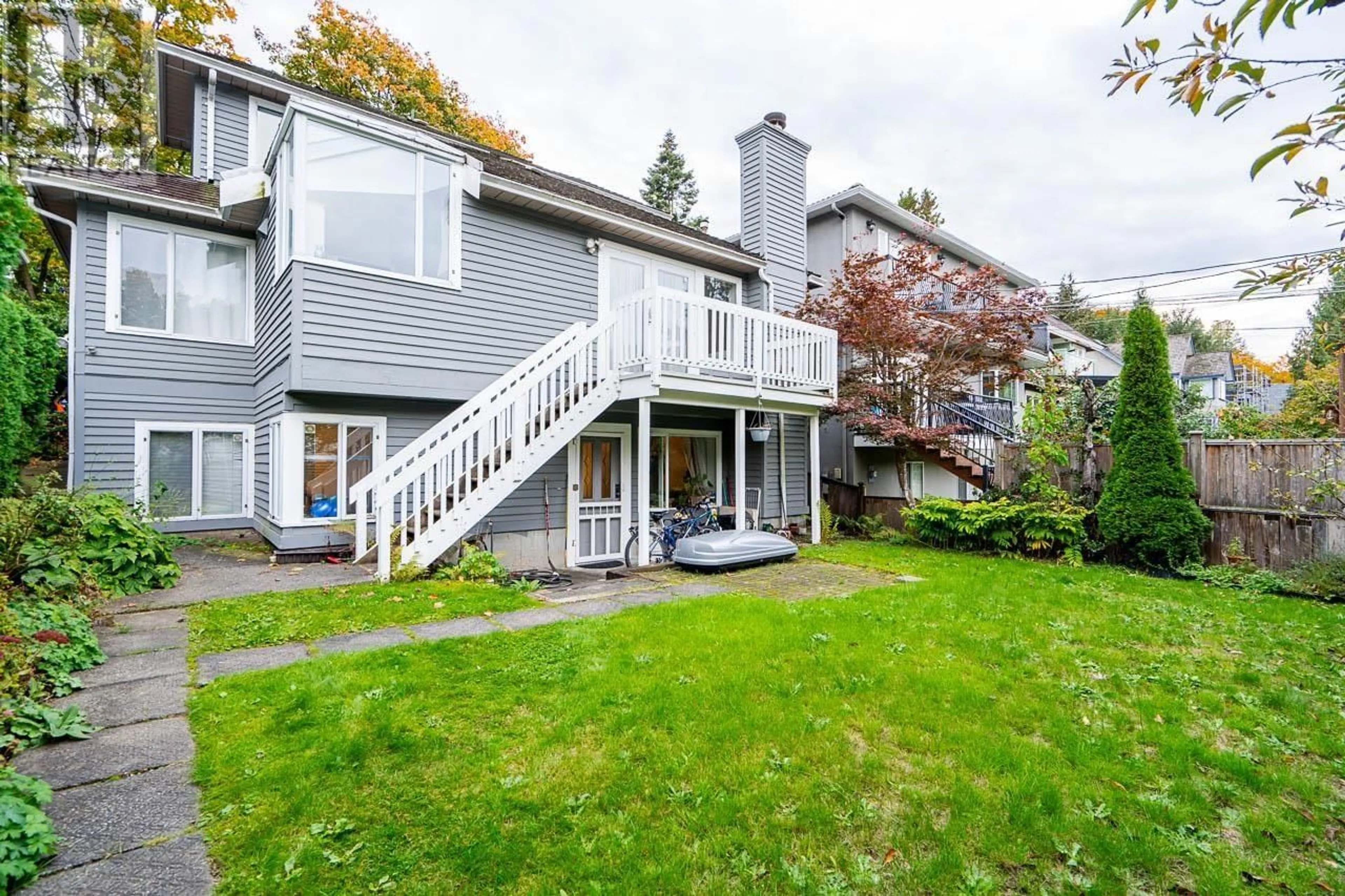 A pic from exterior of the house or condo, the fenced backyard for 825 W 23RD AVENUE, Vancouver British Columbia V5Z2B1