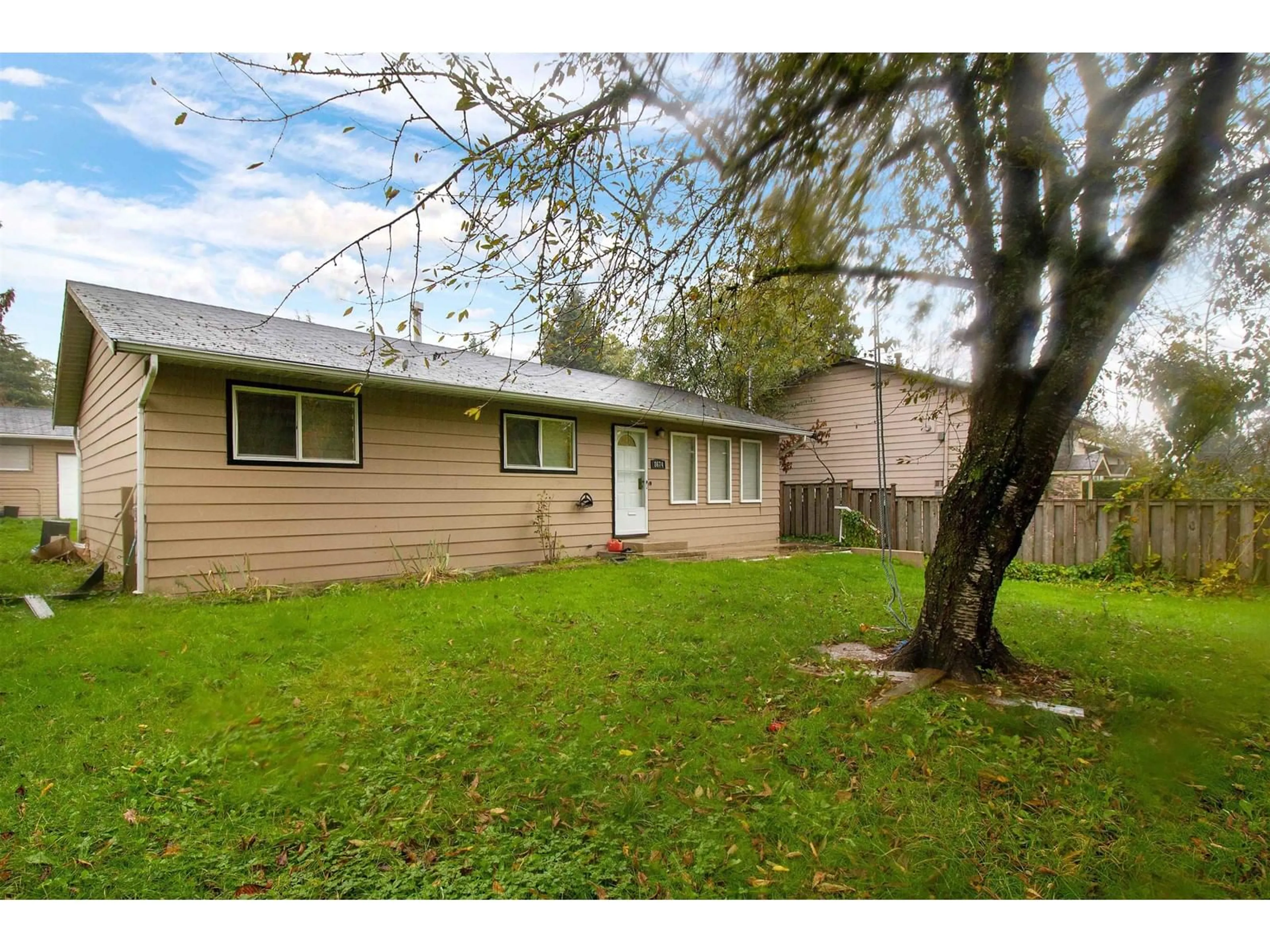 Frontside or backside of a home, the fenced backyard for 8674 152 STREET, Surrey British Columbia V3S3N2