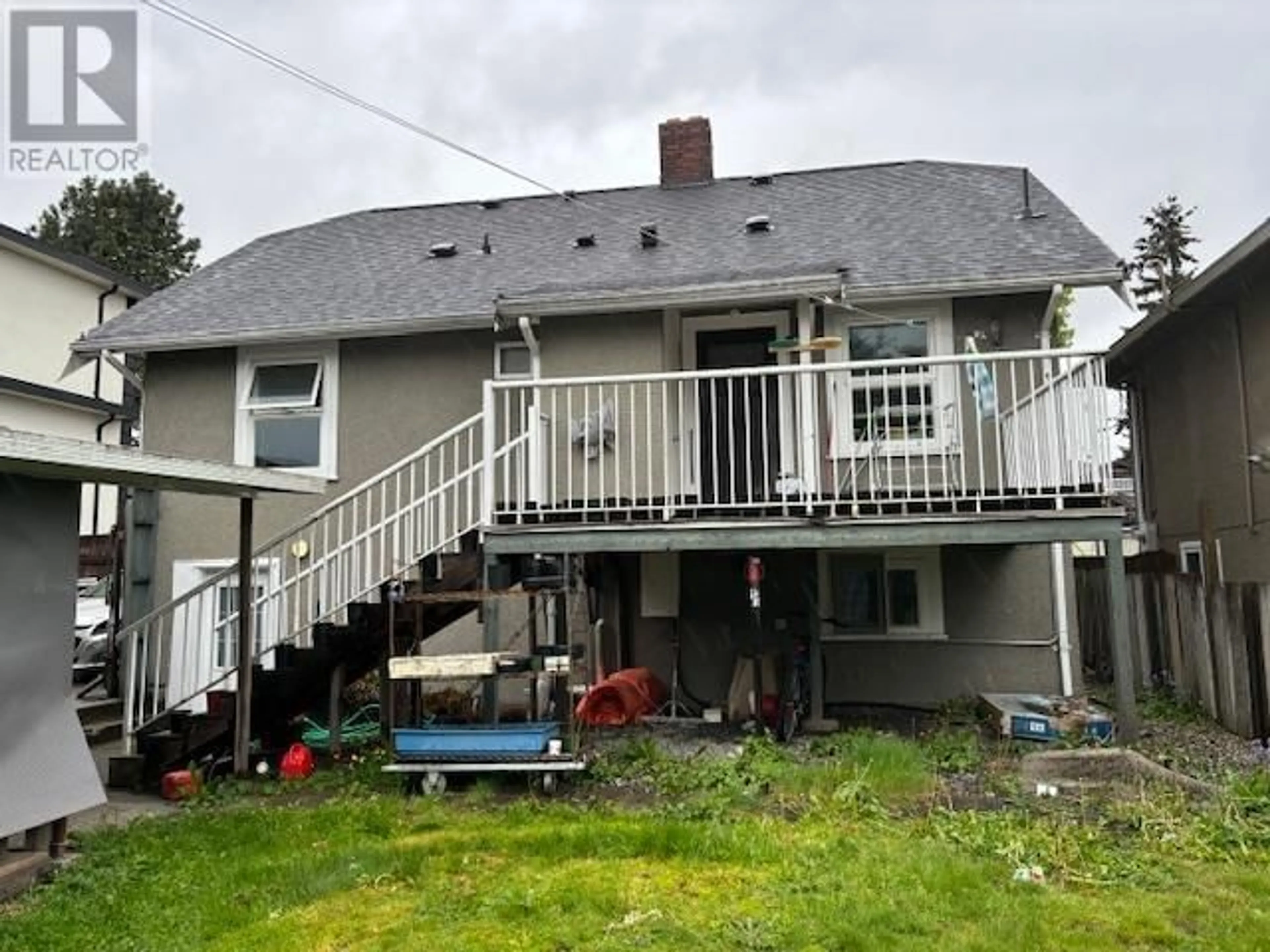 Frontside or backside of a home, the fenced backyard for 7986 15TH AVENUE, Burnaby British Columbia V3N1X1