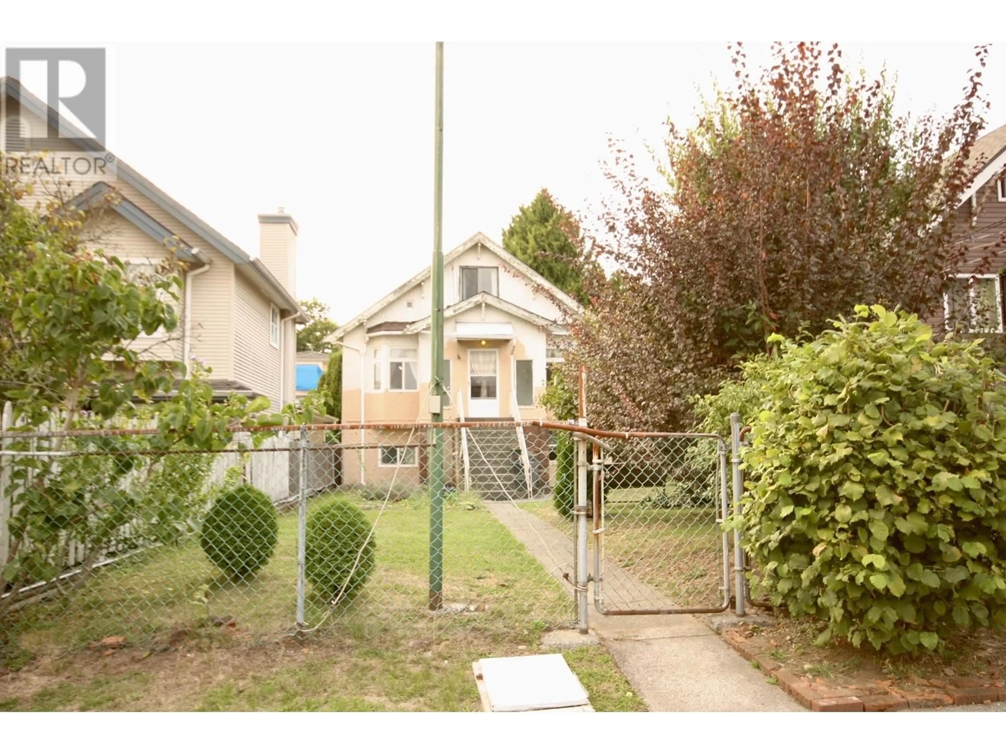 Frontside or backside of a home, the fenced backyard for 5011 CHATHAM STREET, Vancouver British Columbia V5R3Z2