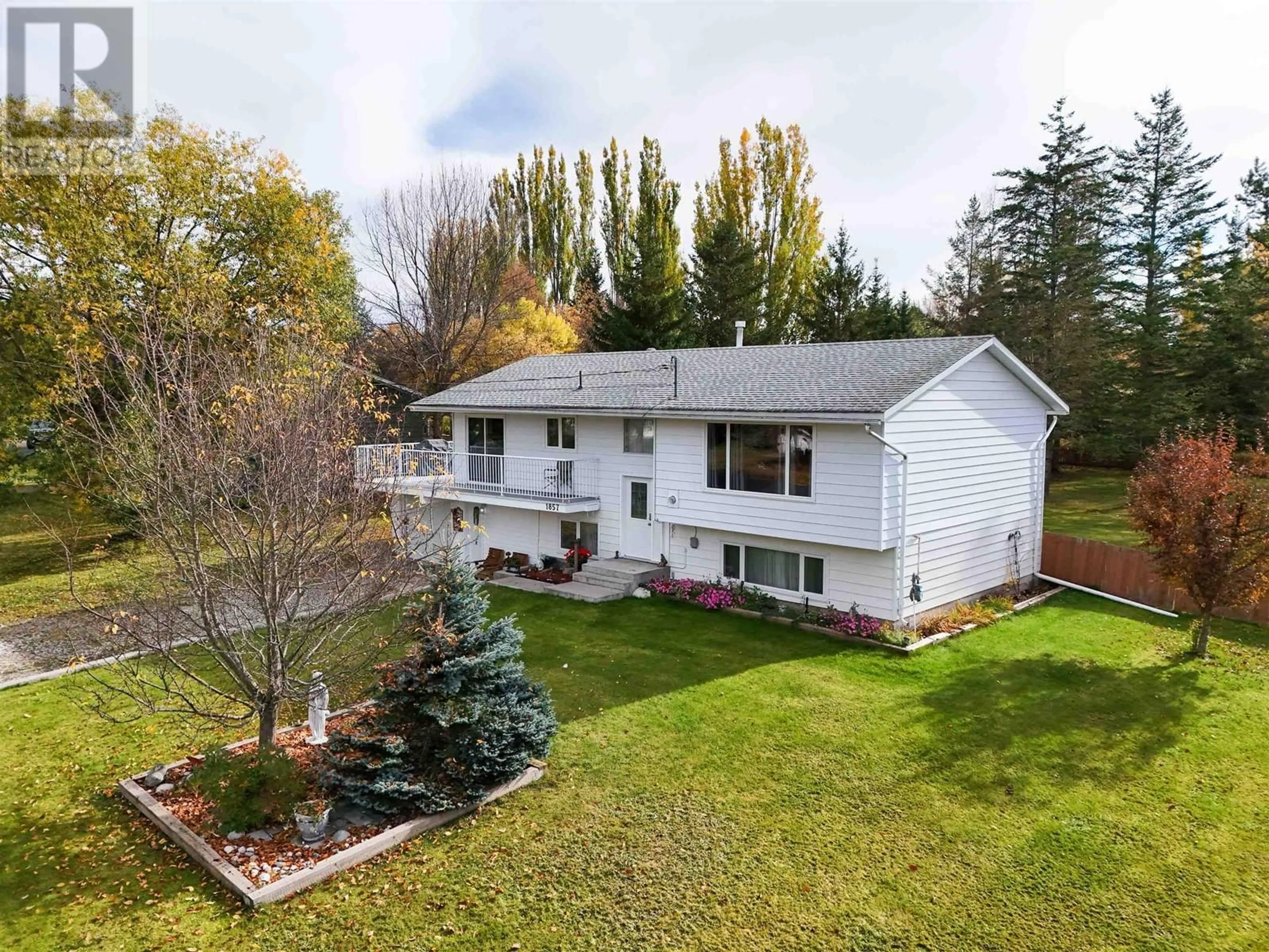 Frontside or backside of a home, the fenced backyard for 1857 DOGWOOD AVENUE, Quesnel British Columbia V2J4T7