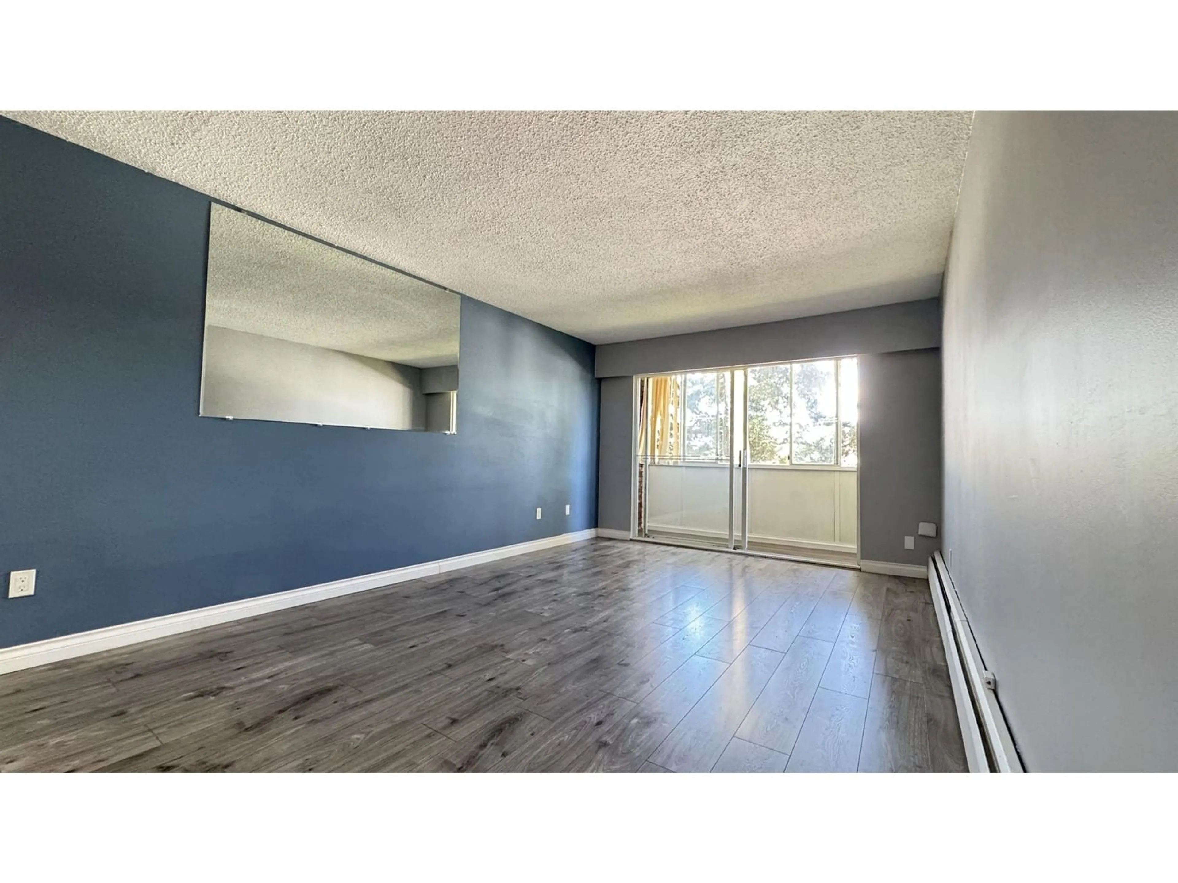 A pic of a room, wood floors for 215A 8635 120 STREET, Delta British Columbia V4C6R5