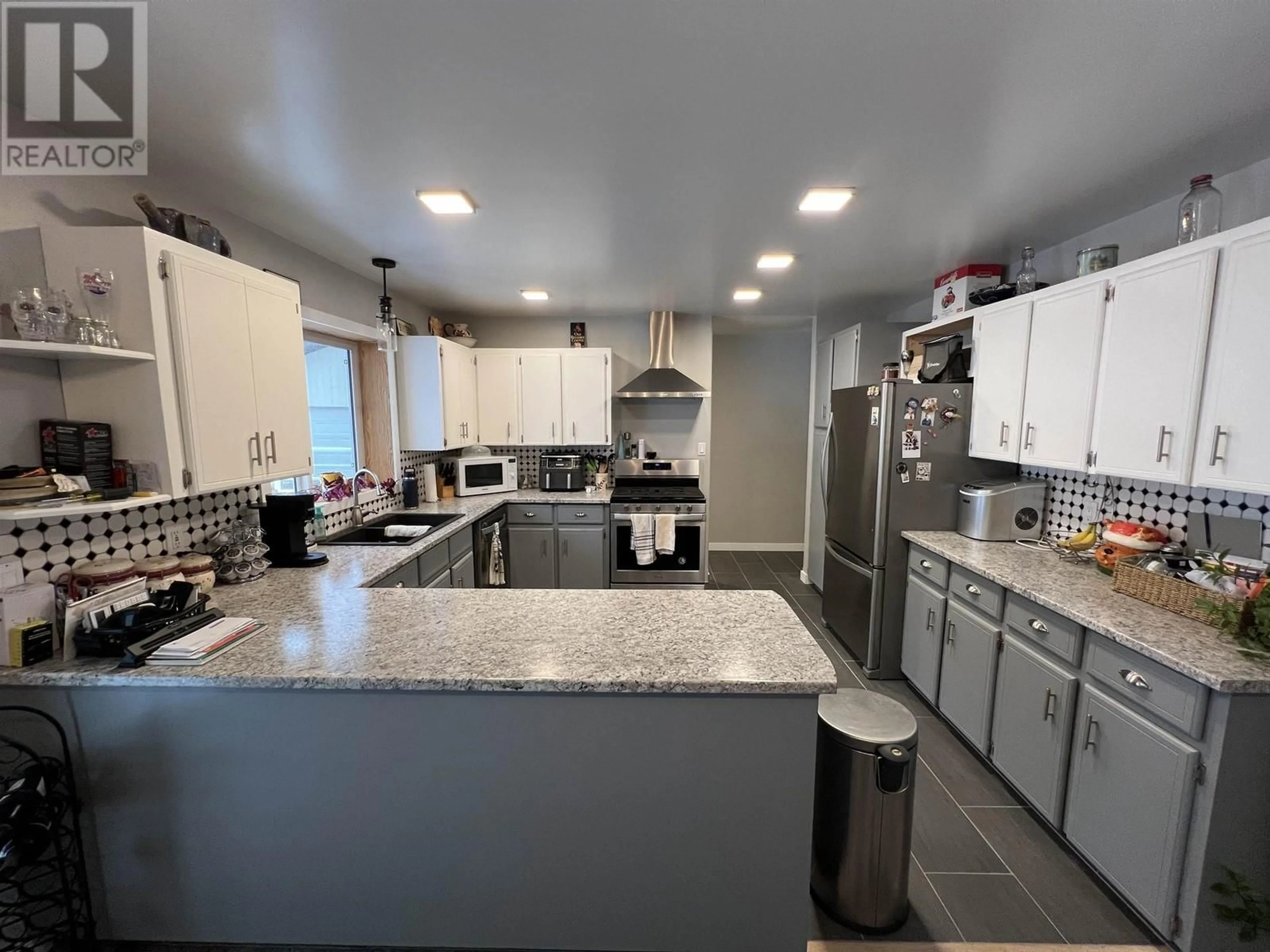 Open concept kitchen, ceramic/tile floor for 7608 OLD ALASKA HIGHWAY, Fort Nelson British Columbia V0C1R0