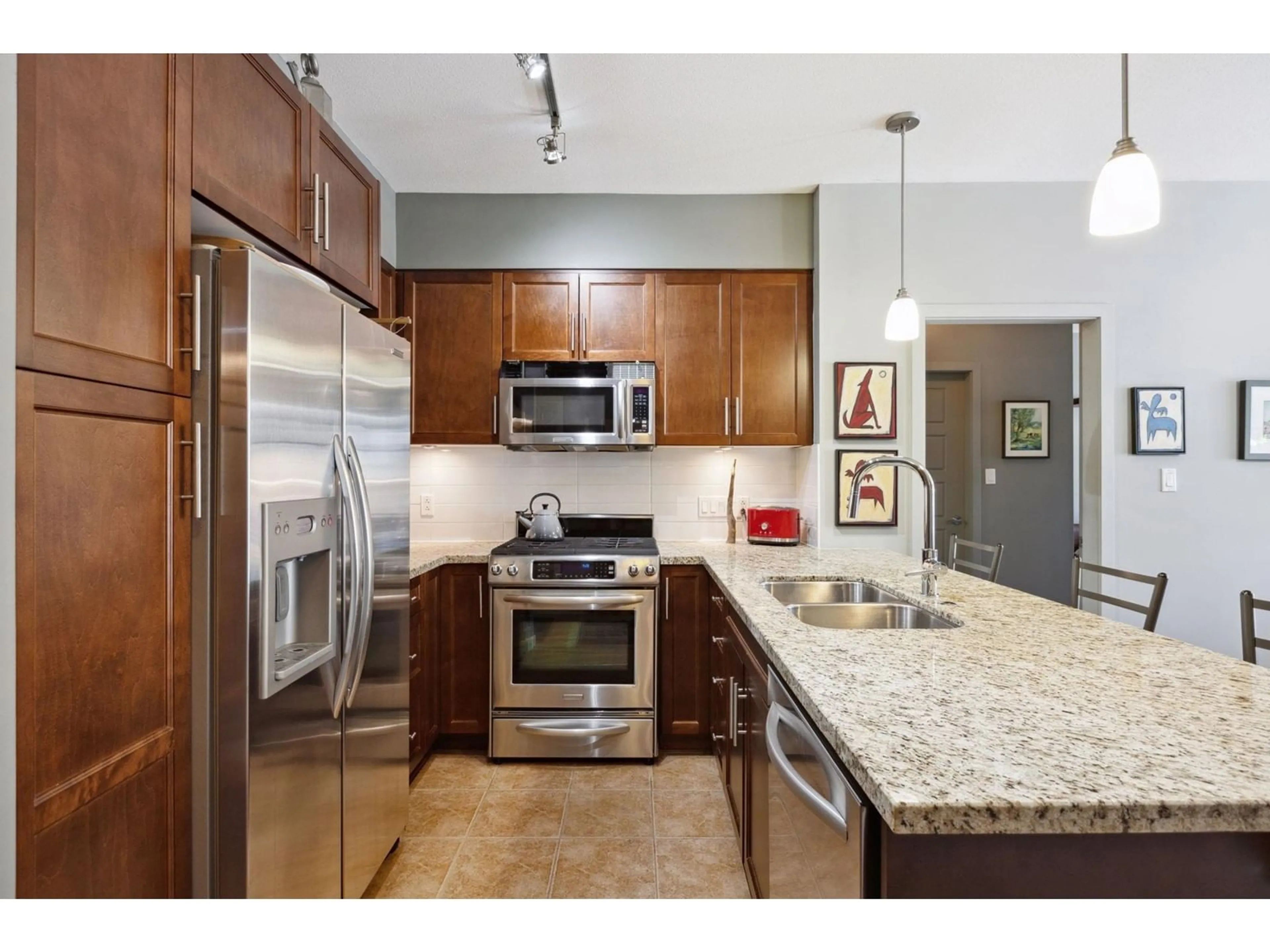 Standard kitchen, wood floors for 211 23215 BILLY BROWN ROAD, Langley British Columbia V1M0B7