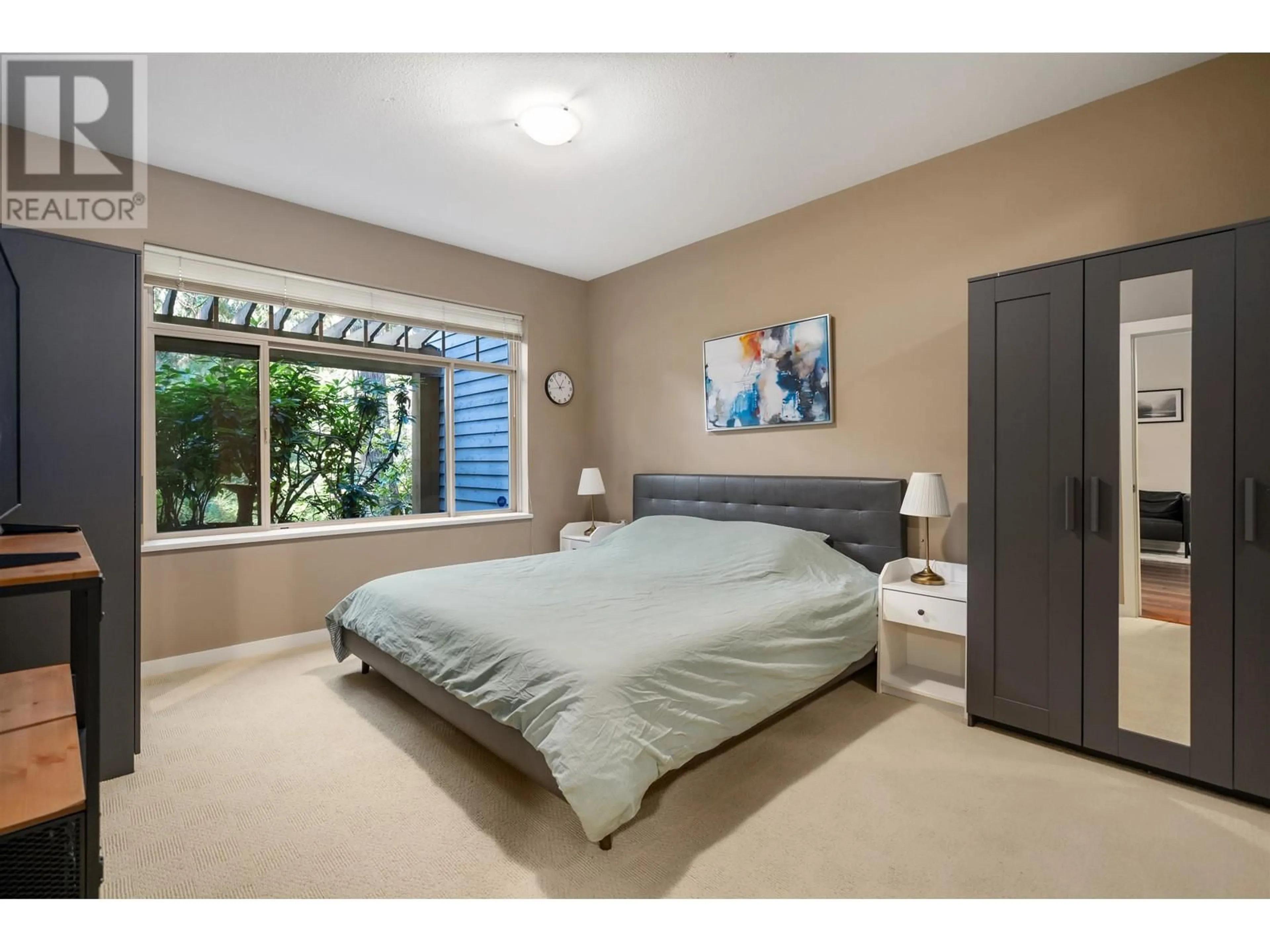 A pic of a room, carpet floors for 108 3125 CAPILANO CRESCENT, North Vancouver British Columbia V7R4X5