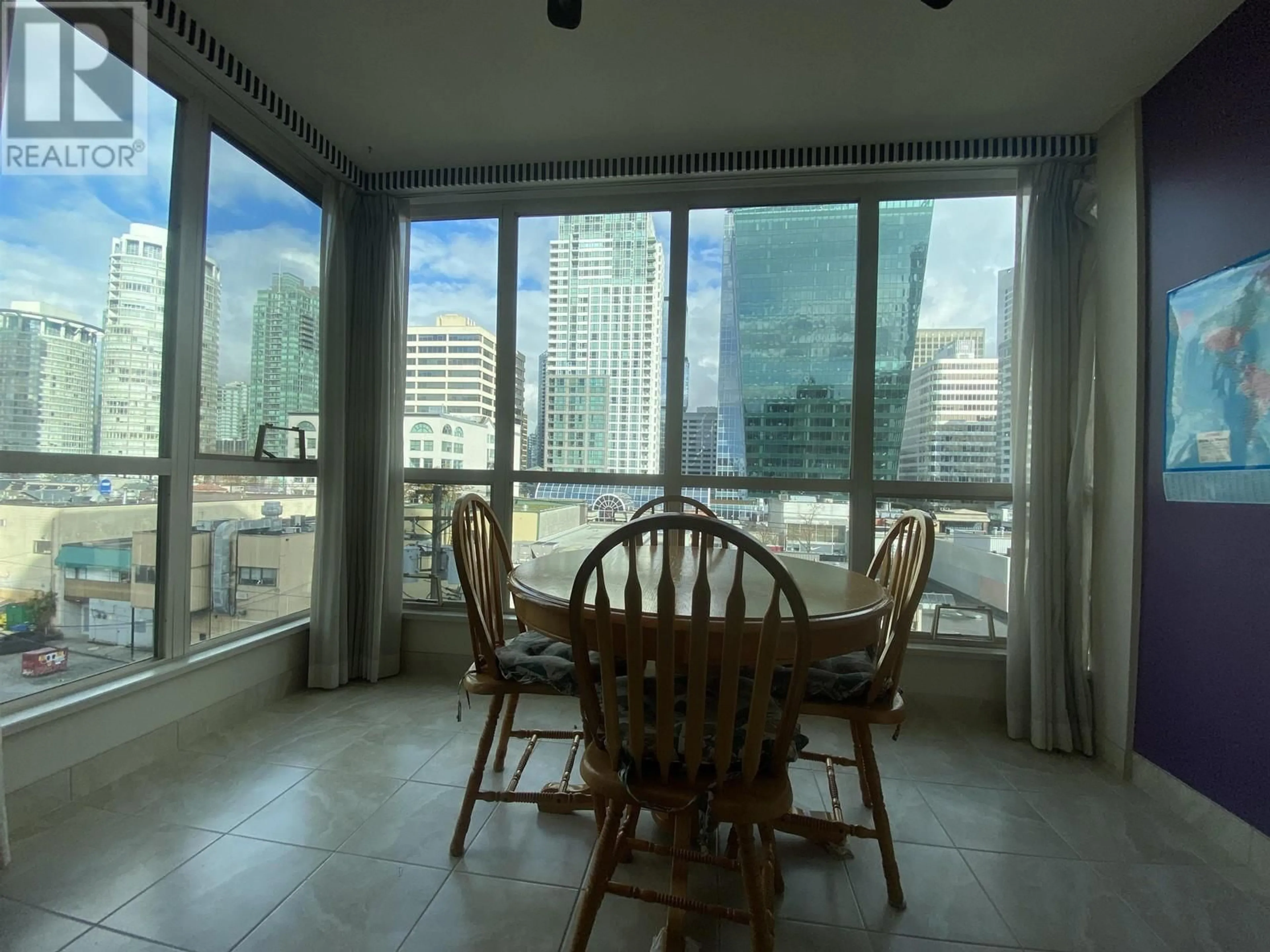 Dining room, unknown floor, the view of city buildings for 503 1111 HARO STREET, Vancouver British Columbia V6E1E3