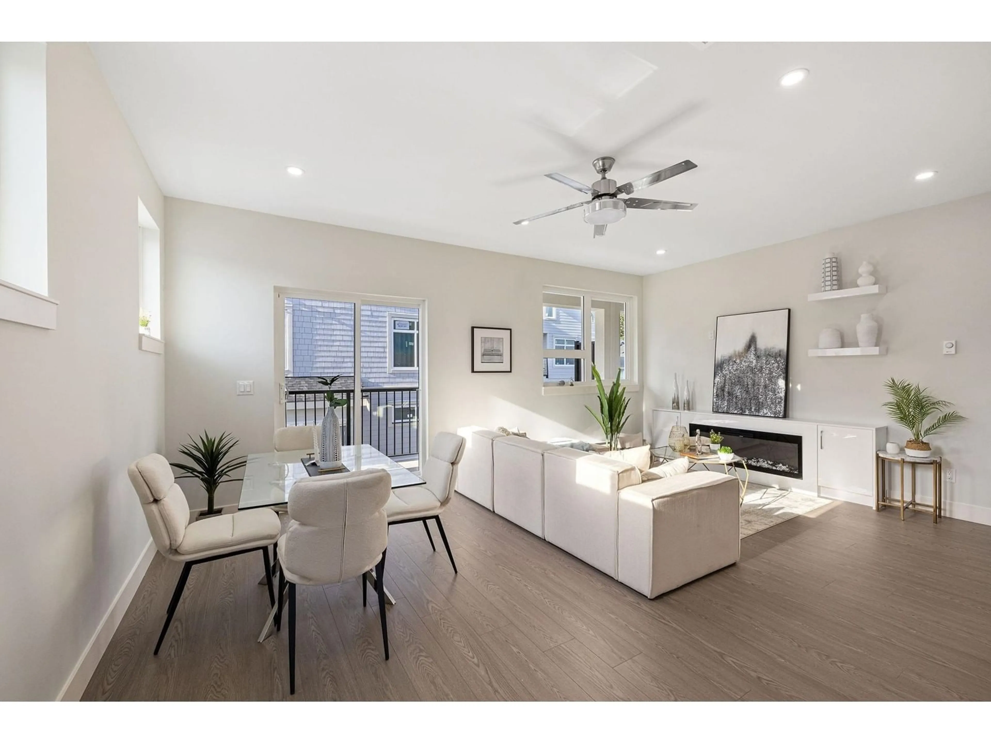 Living room with furniture, wood/laminate floor for 1 14391 61A AVENUE, Surrey British Columbia V3X0E5