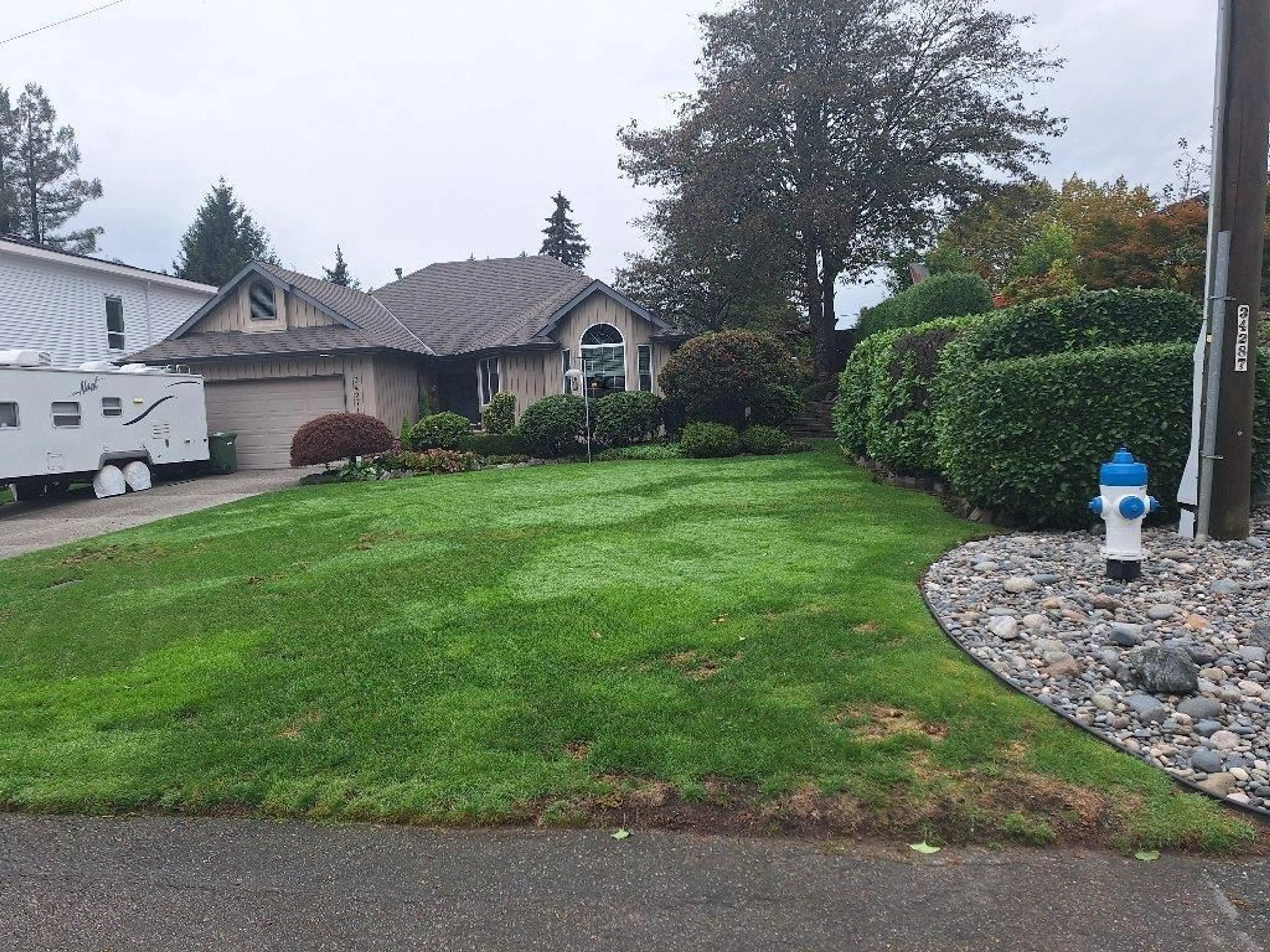 Frontside or backside of a home, the fenced backyard for 34271 FRASER STREET, Abbotsford British Columbia V2S1X8