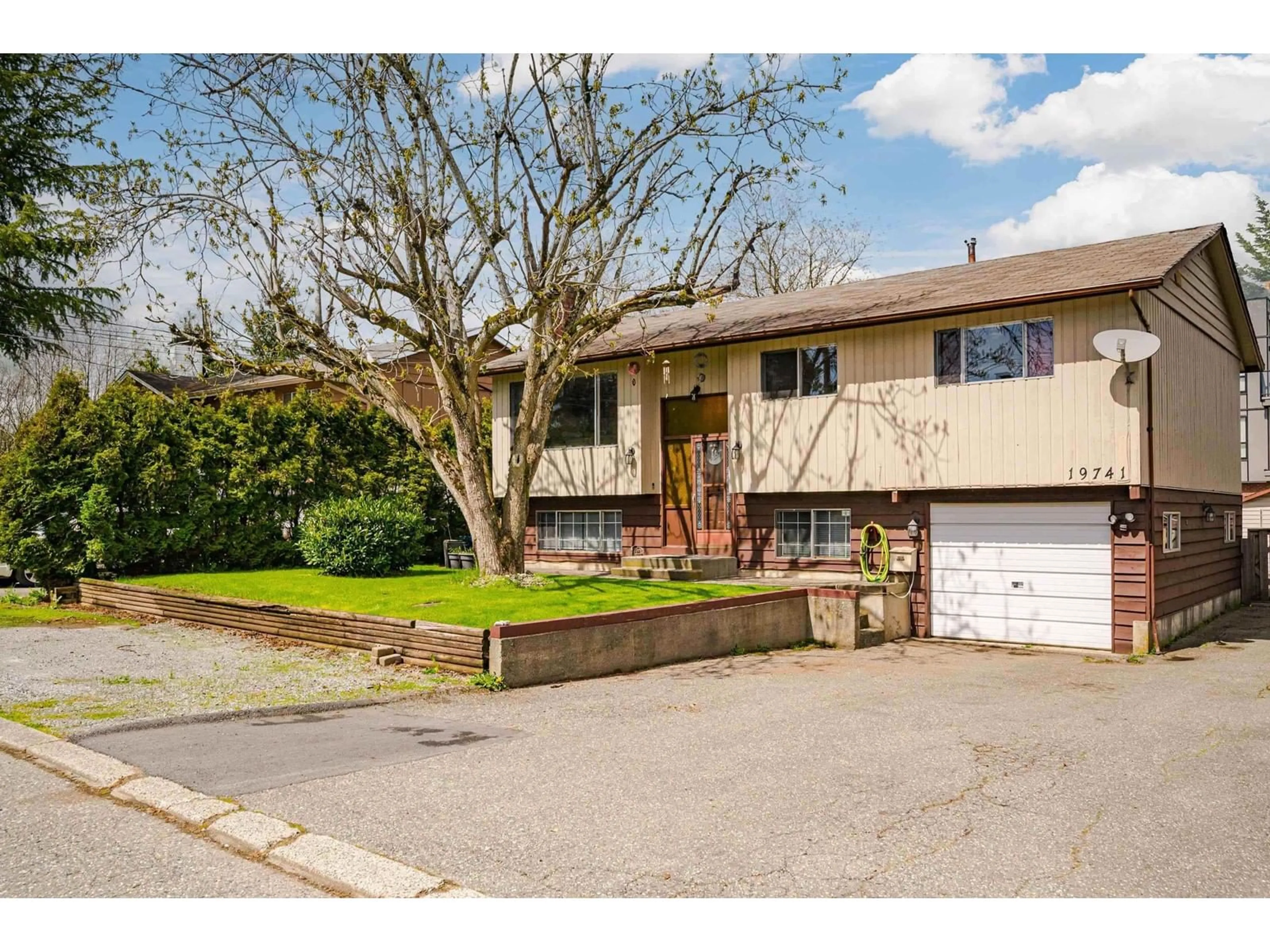 Frontside or backside of a home for 19741 54A AVENUE, Surrey British Columbia V3A3W4