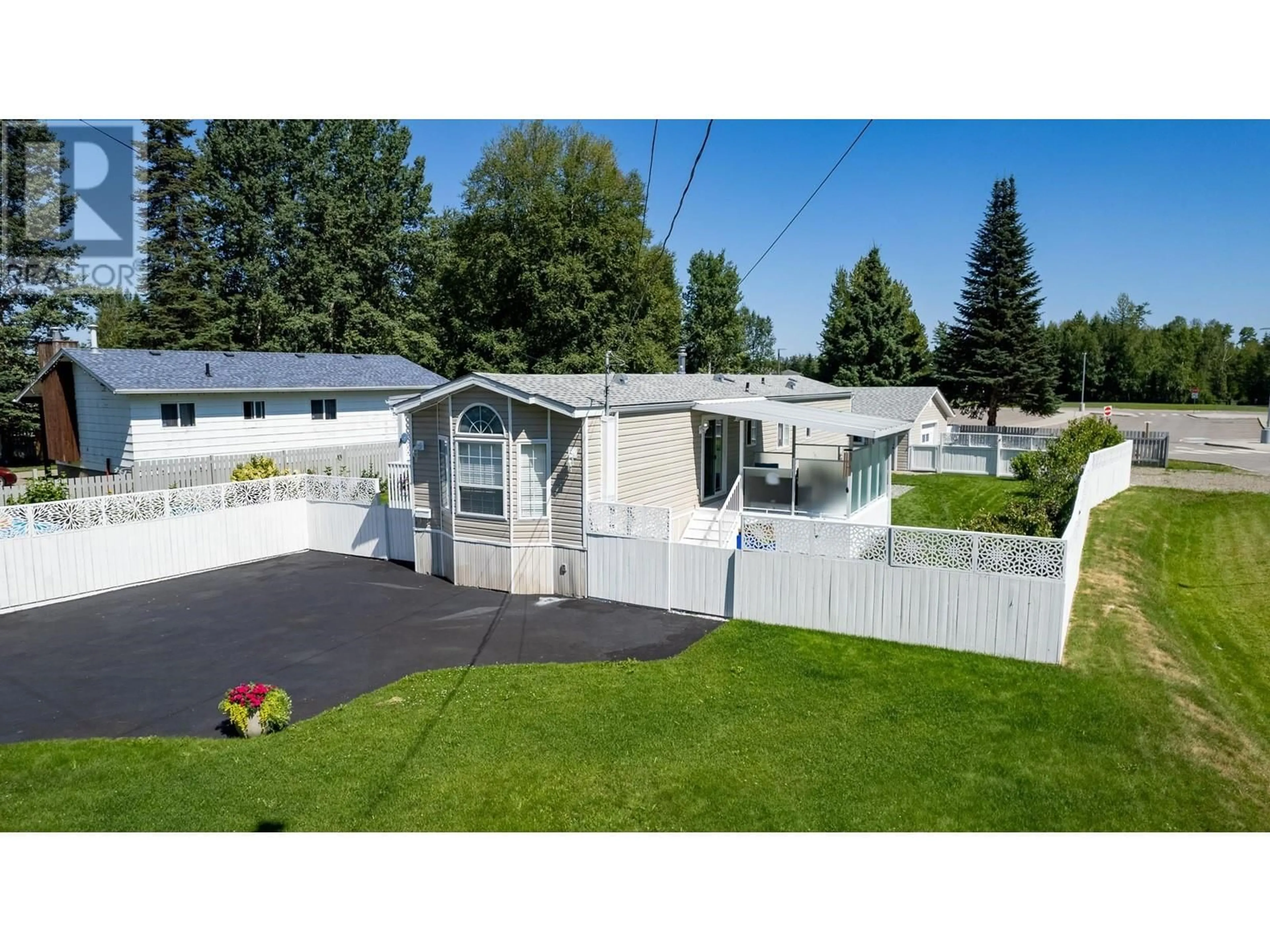 Frontside or backside of a home, the fenced backyard for 7310 DAWSON ROAD, Prince George British Columbia V2K2M1