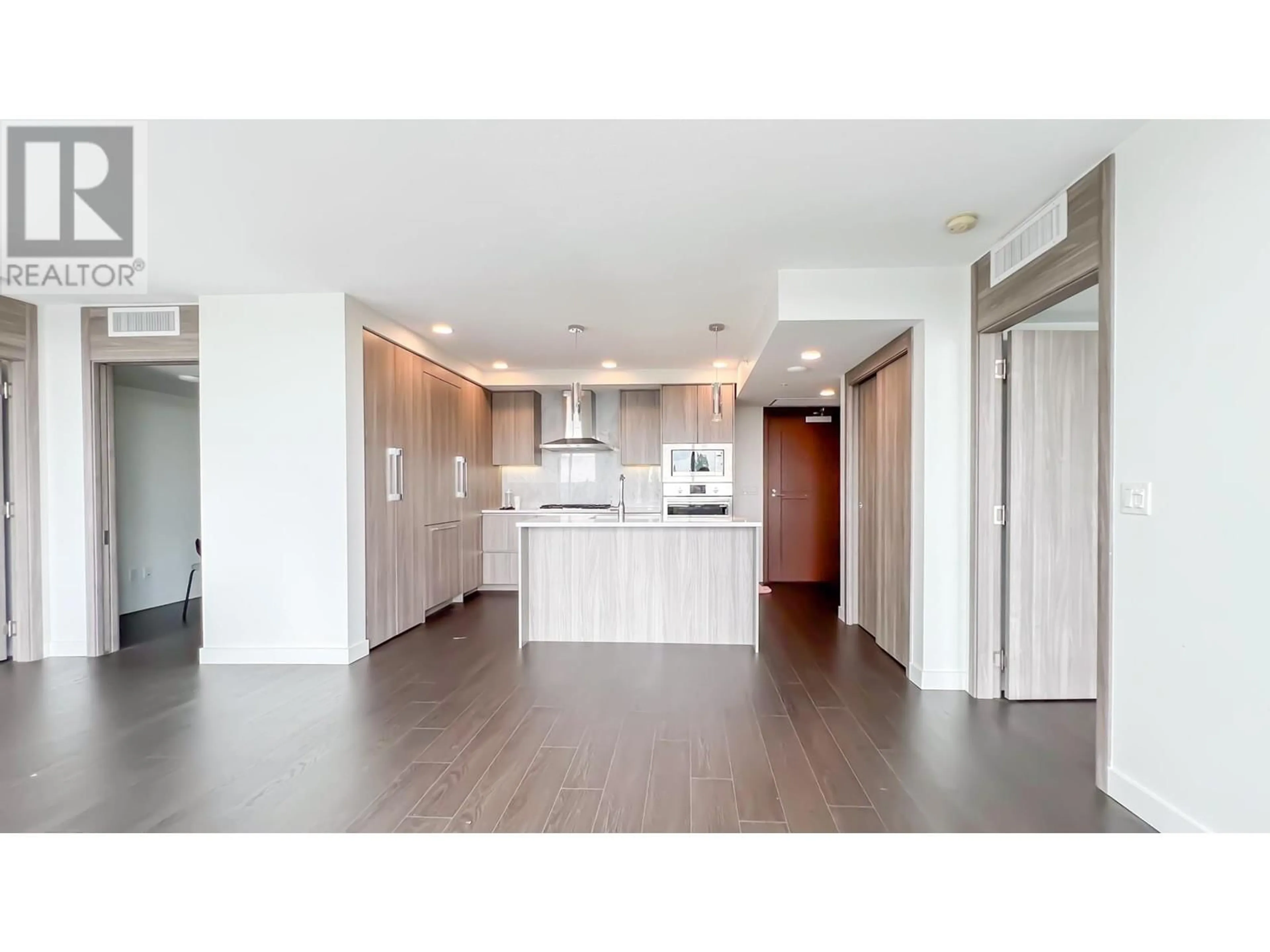 Open concept kitchen, wood/laminate floor for 1211 8800 HAZELBRIDGE WAY, Richmond British Columbia V6X0S3