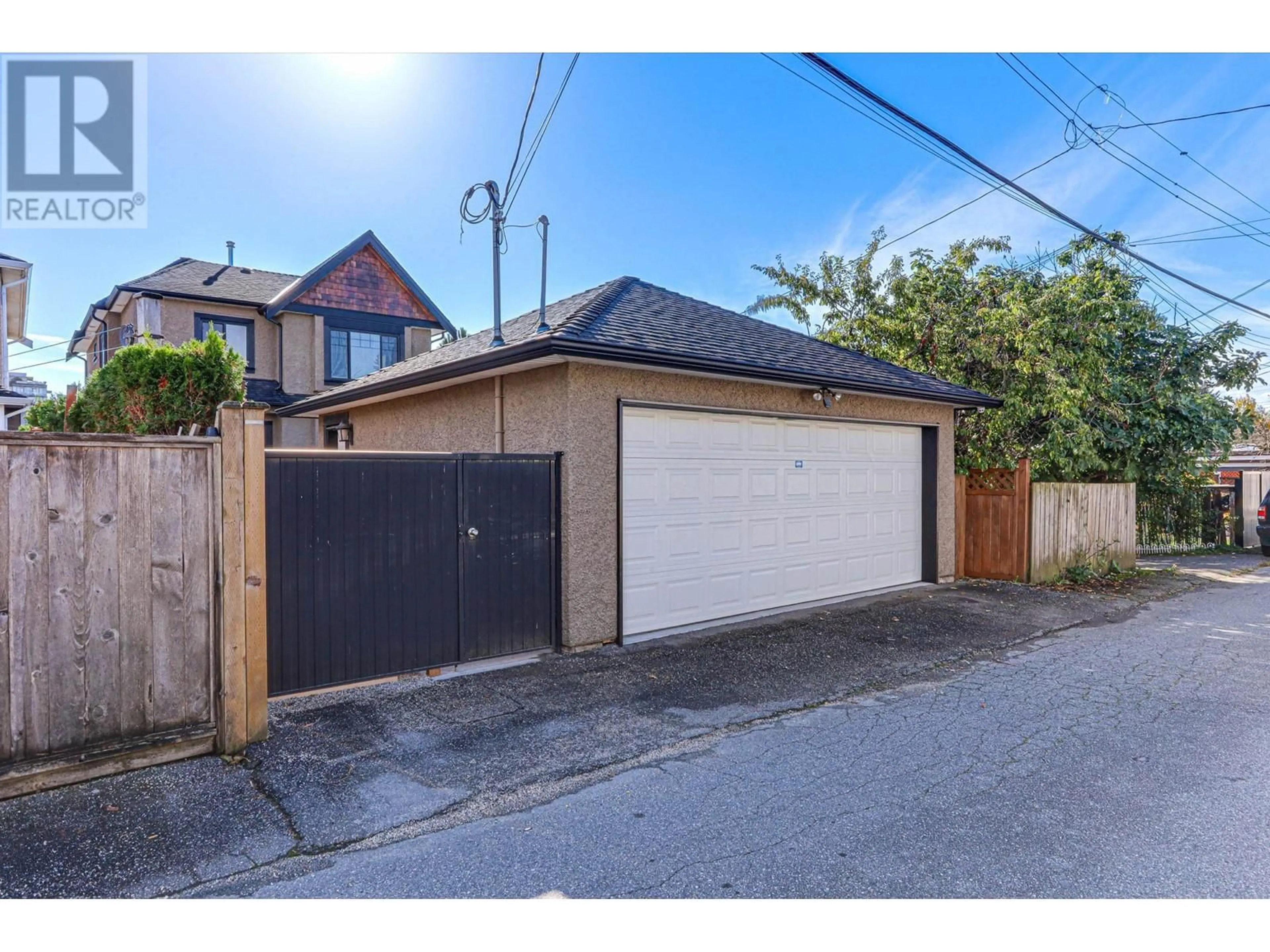 Frontside or backside of a home, the fenced backyard for 1529 W 66TH AVENUE, Vancouver British Columbia V6P2R8