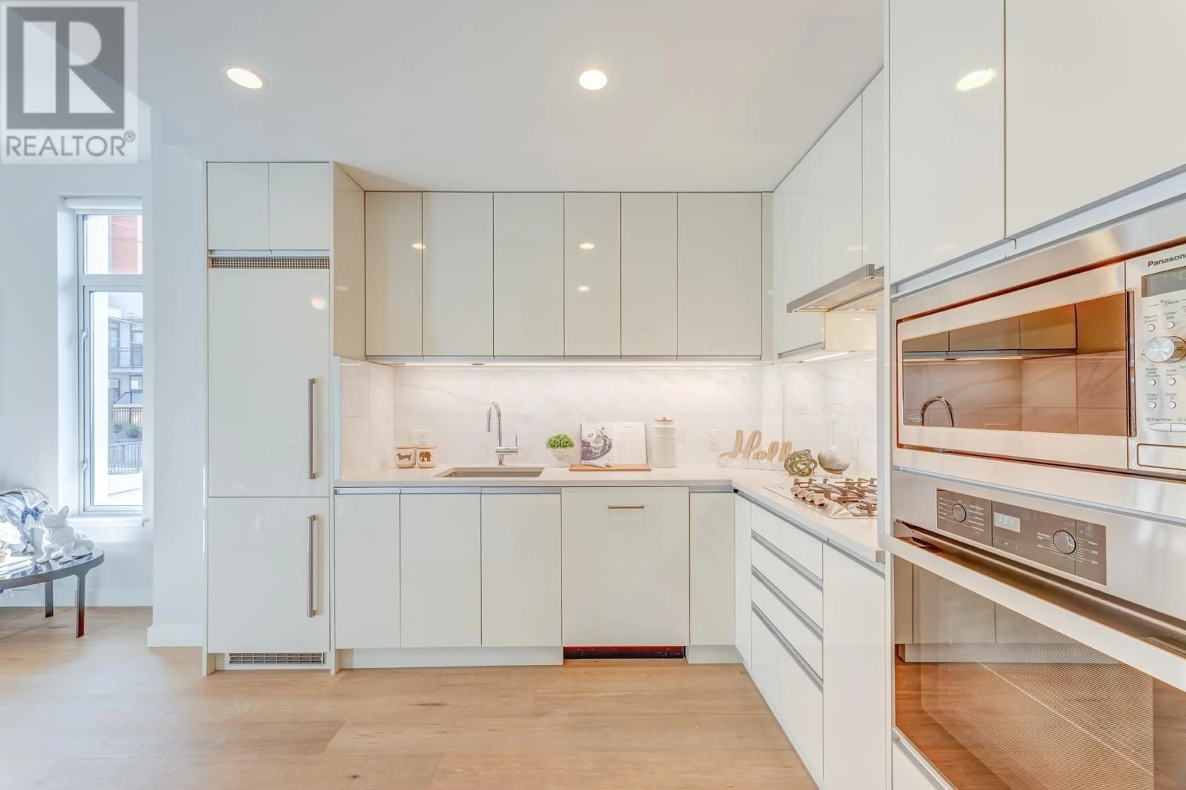 Contemporary kitchen, wood floors for 214 528 W KING EDWARD AVENUE, Vancouver British Columbia V5Z2C3