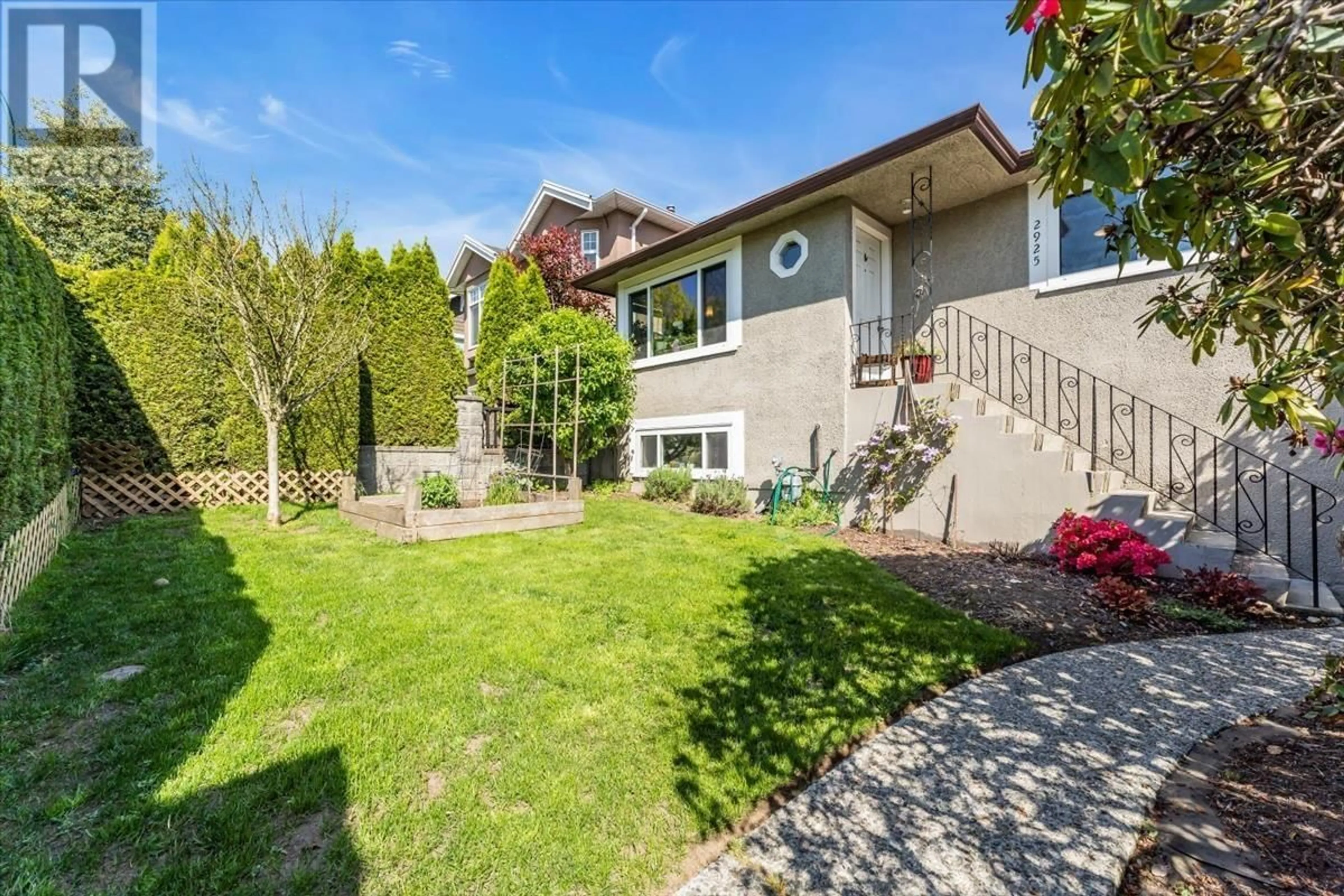 Frontside or backside of a home, the fenced backyard for 2925 MCGILL STREET, Vancouver British Columbia V5K1H8