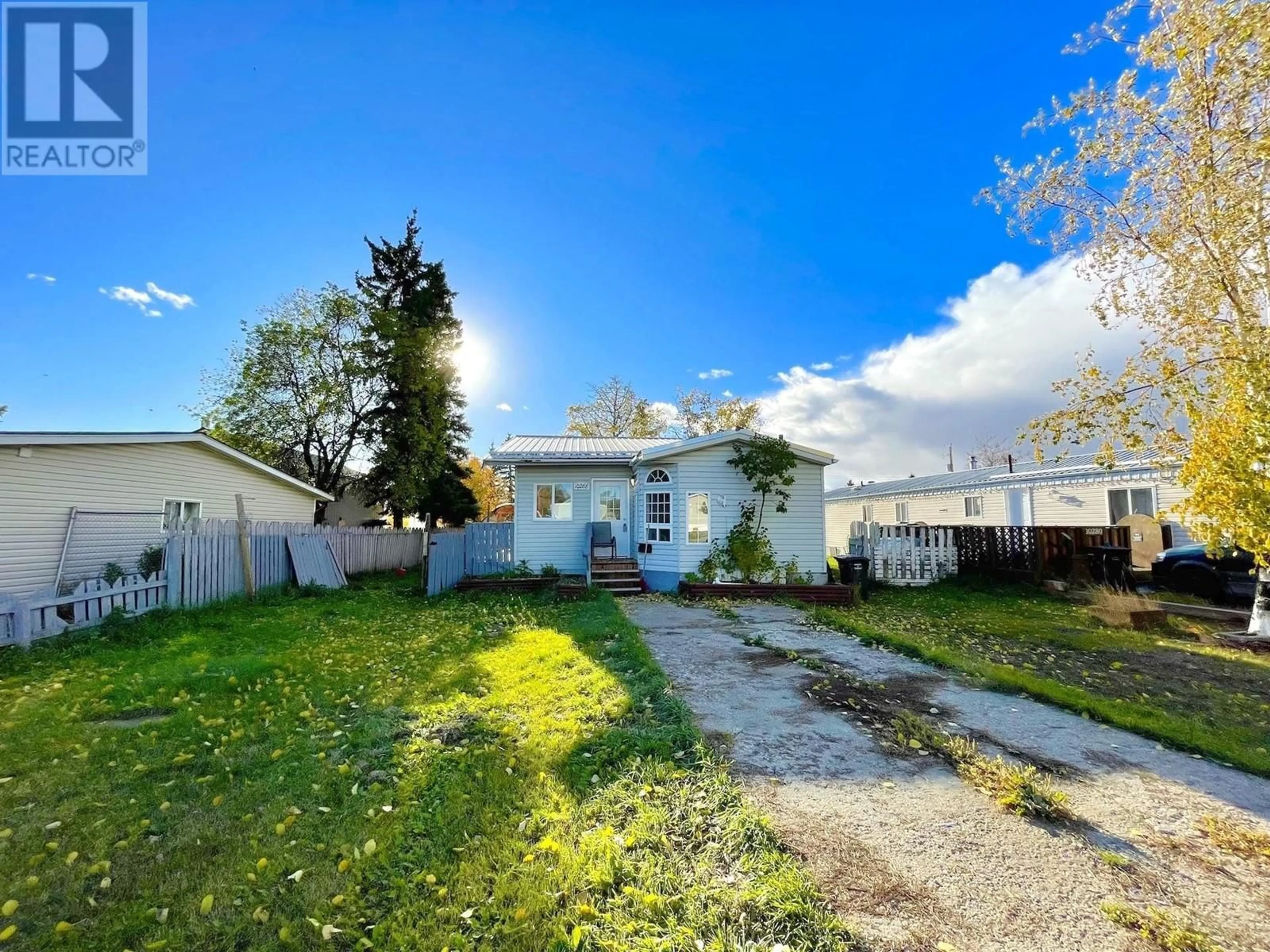 Frontside or backside of a home, the fenced backyard for 10288 99 STREET, Taylor British Columbia V0C2K0