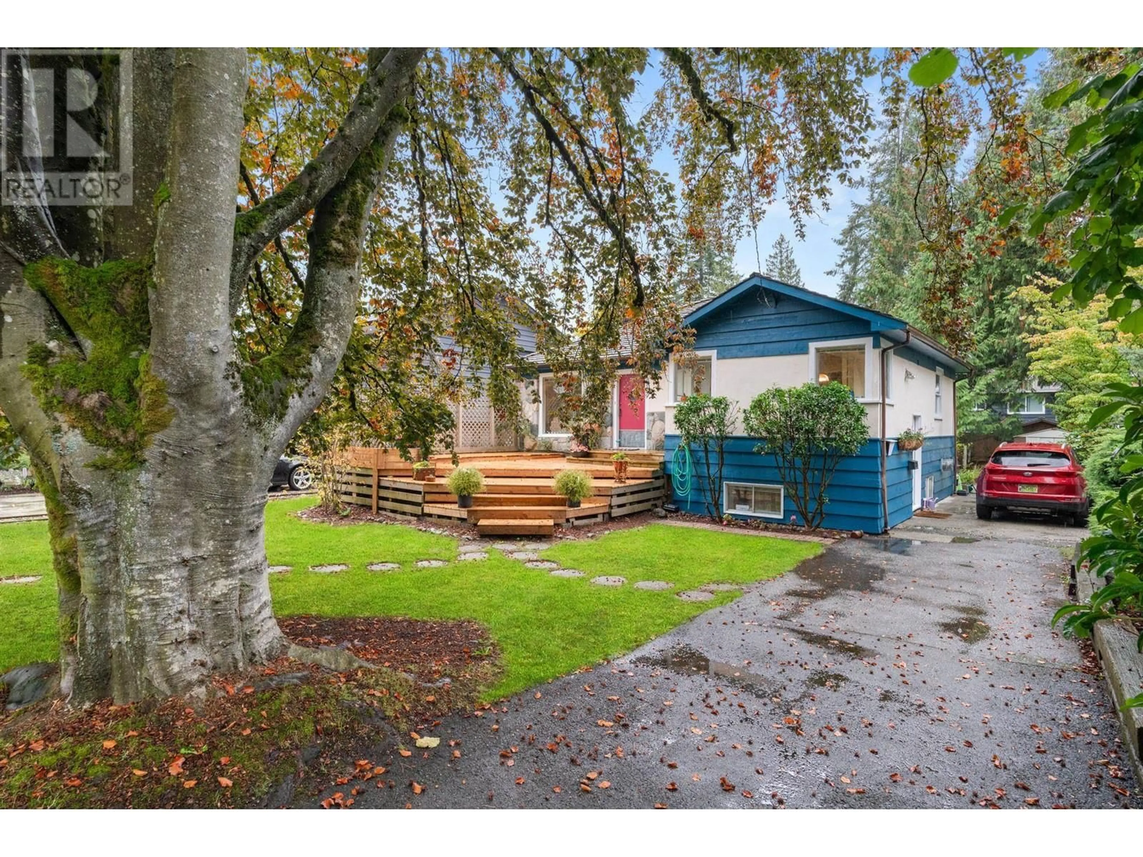 Frontside or backside of a home, the fenced backyard for 1129 W 24 STREET, North Vancouver British Columbia V7P2J1