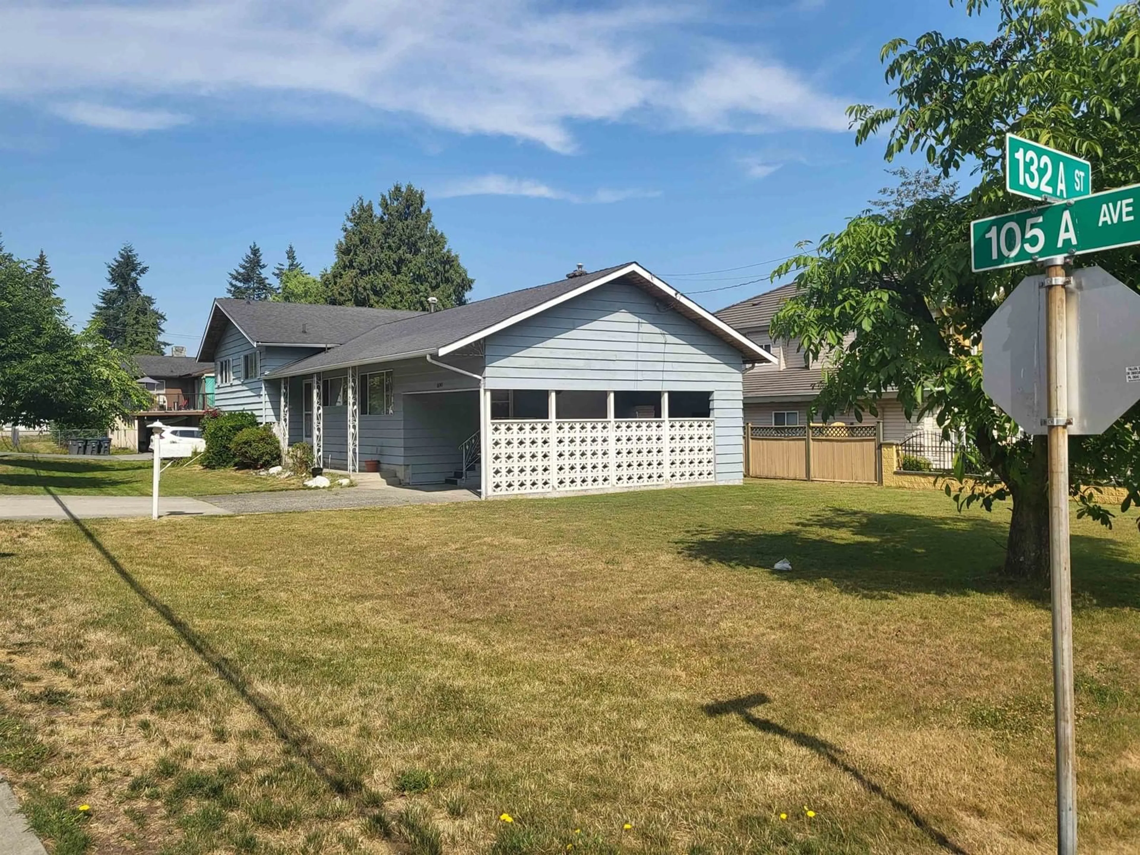 Frontside or backside of a home, the fenced backyard for 13243 105A AVENUE, Surrey British Columbia V3T2A3