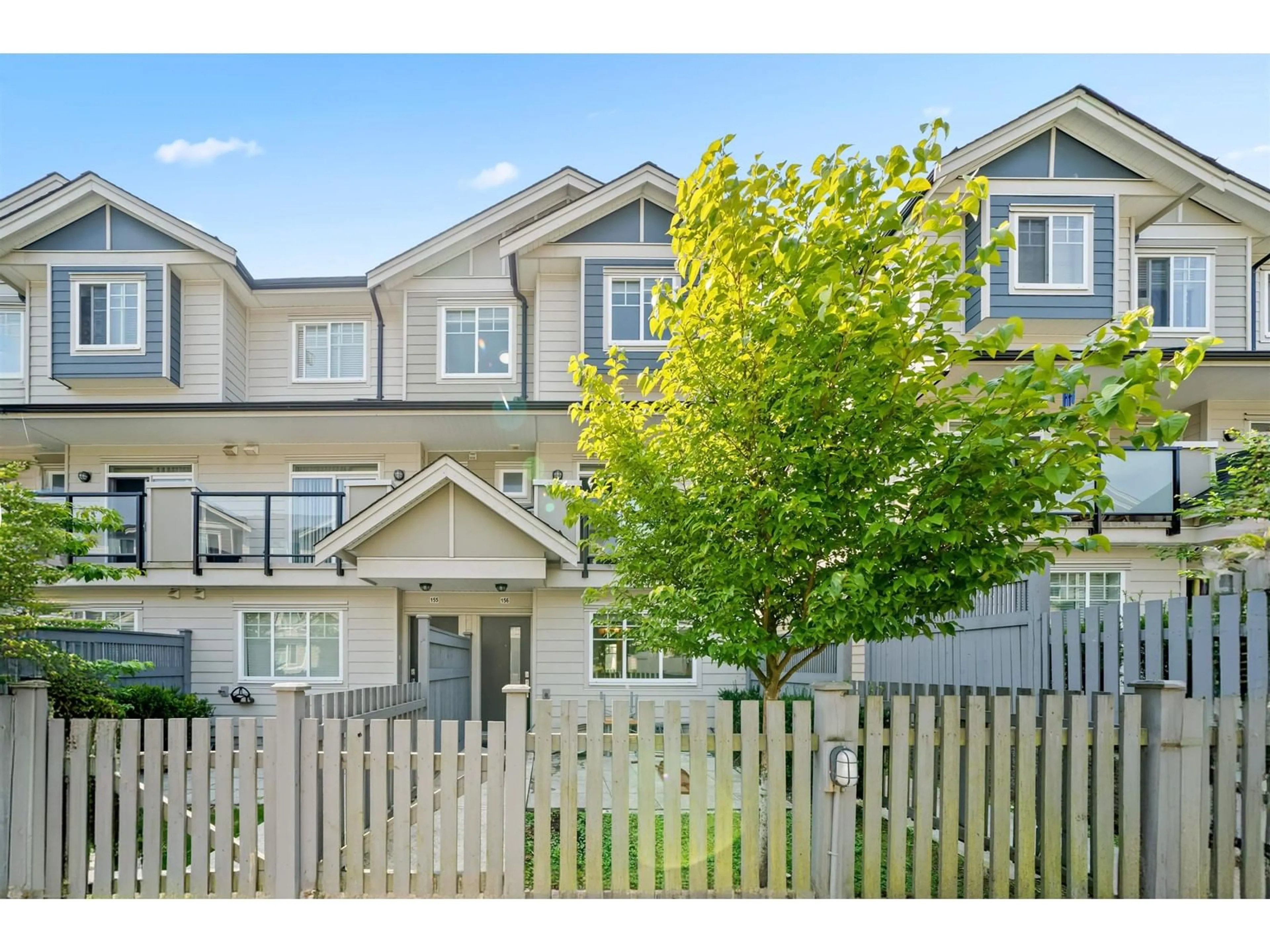 A pic from exterior of the house or condo, the fenced backyard for 156 13898 64 AVENUE, Surrey British Columbia V3W1L6