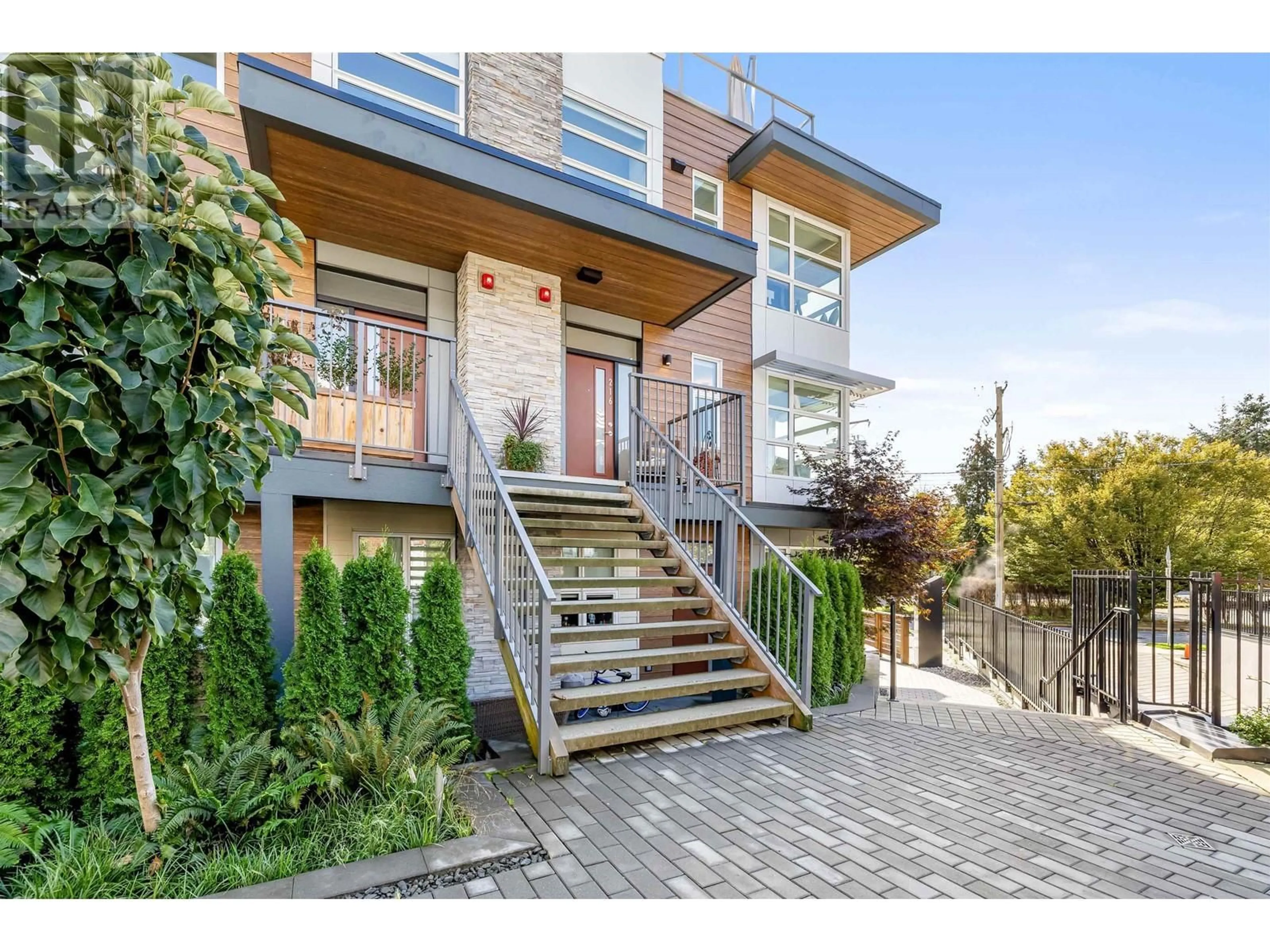 Home with brick exterior material for 216 2060 CURLING ROAD, North Vancouver British Columbia V7P0E1