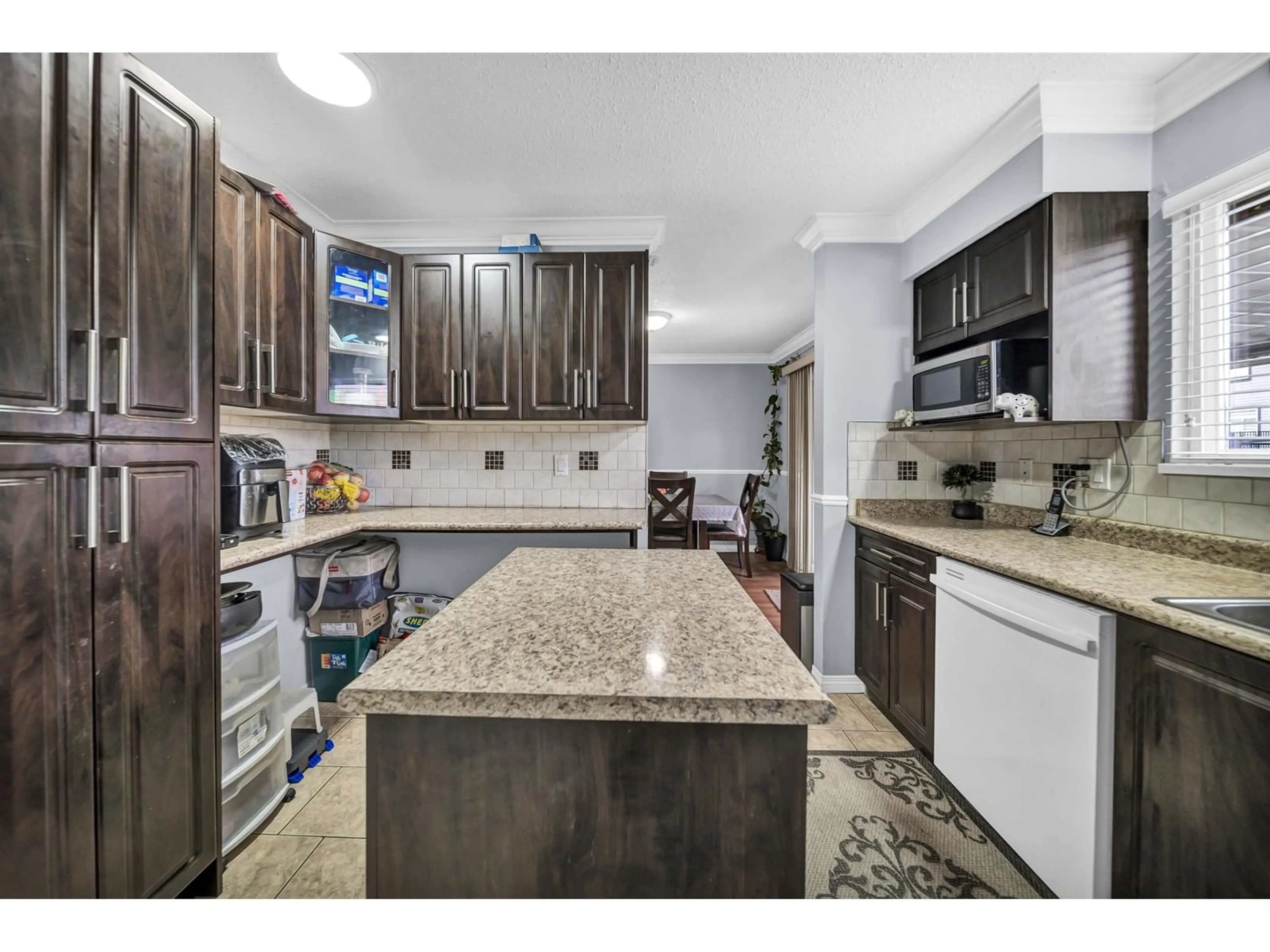 Open concept kitchen for 6721 132 STREET, Surrey British Columbia V3W4L7