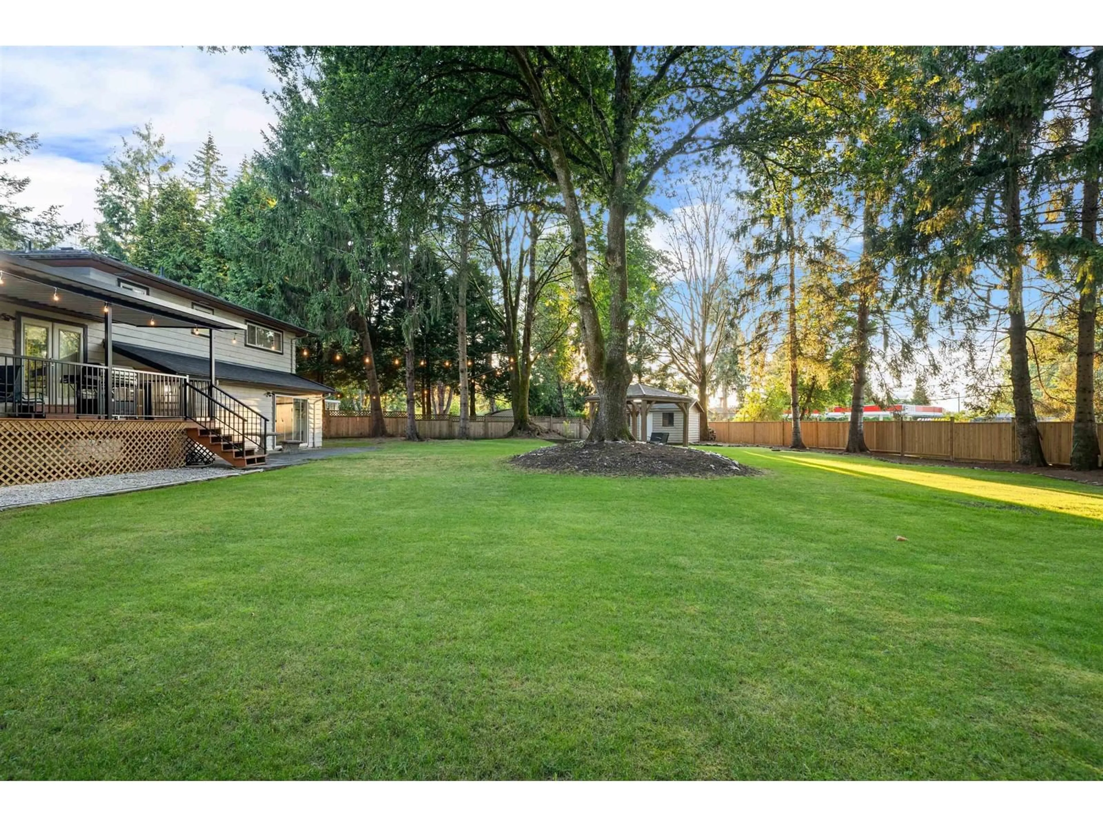 Frontside or backside of a home, the fenced backyard for 14380 GREENCREST DRIVE, Surrey British Columbia V4P1M1