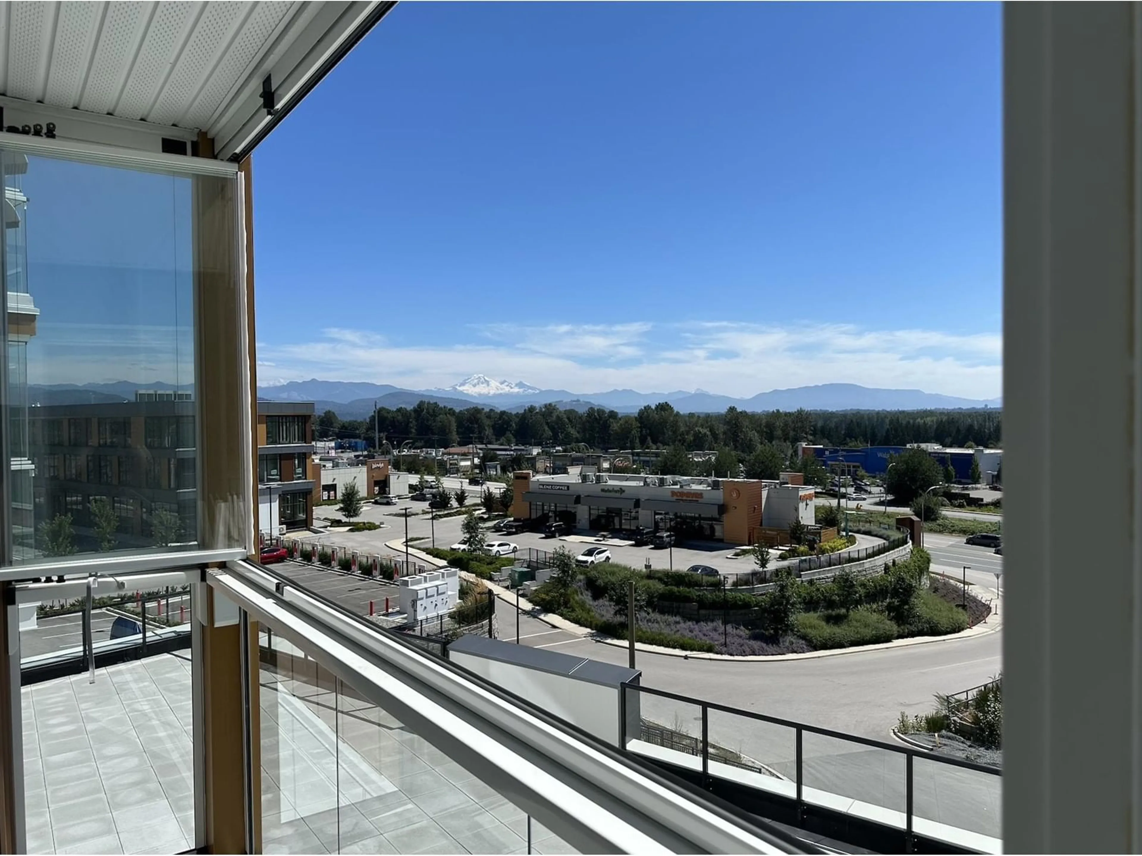 Balcony in the apartment, the view of city buildings for A202 31900 RAVEN AVENUE, Mission British Columbia V2V0L1