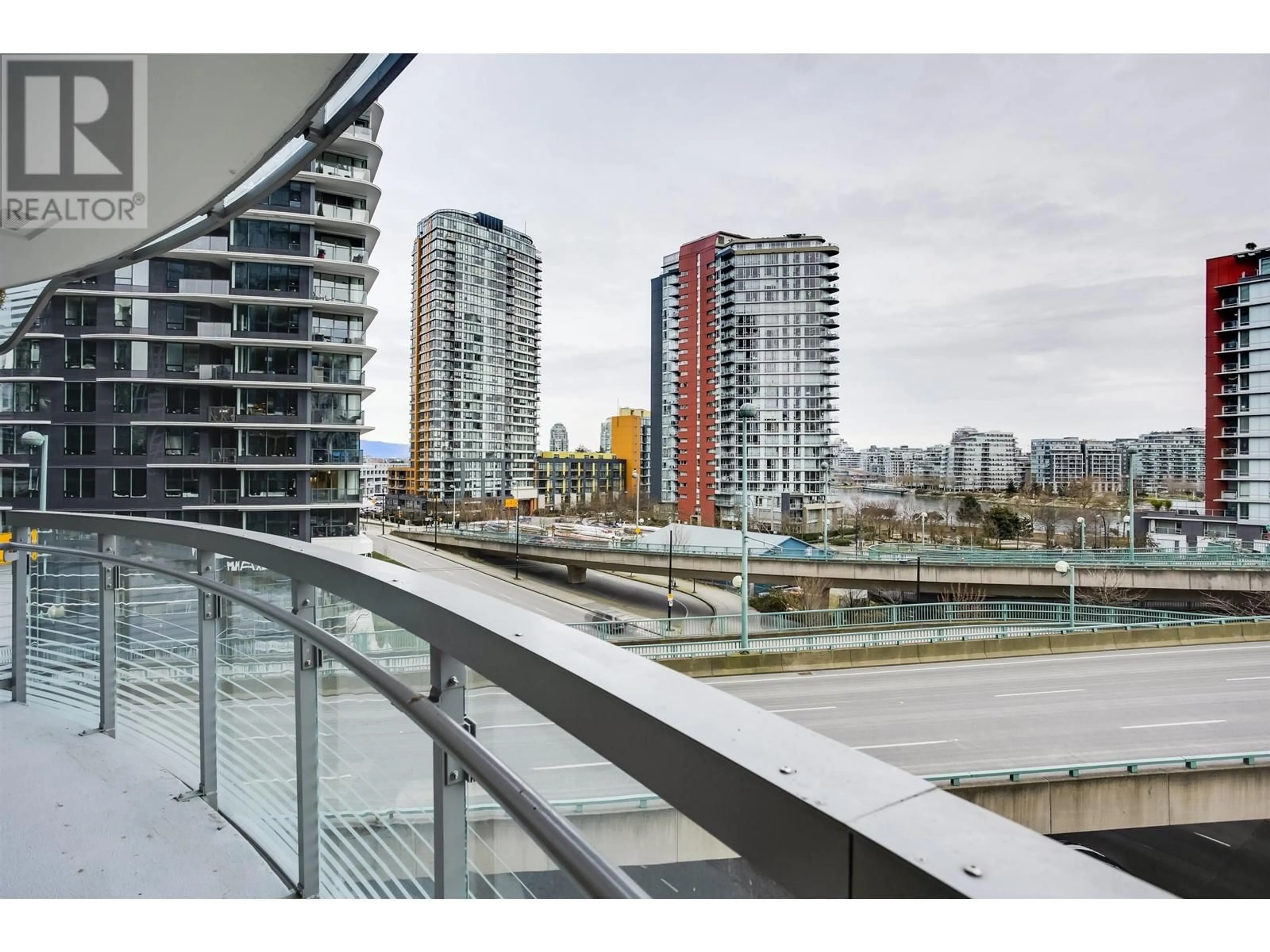 A pic from exterior of the house or condo, the view of city buildings for 584 87 NELSON STREET, Vancouver British Columbia V6Z0E8