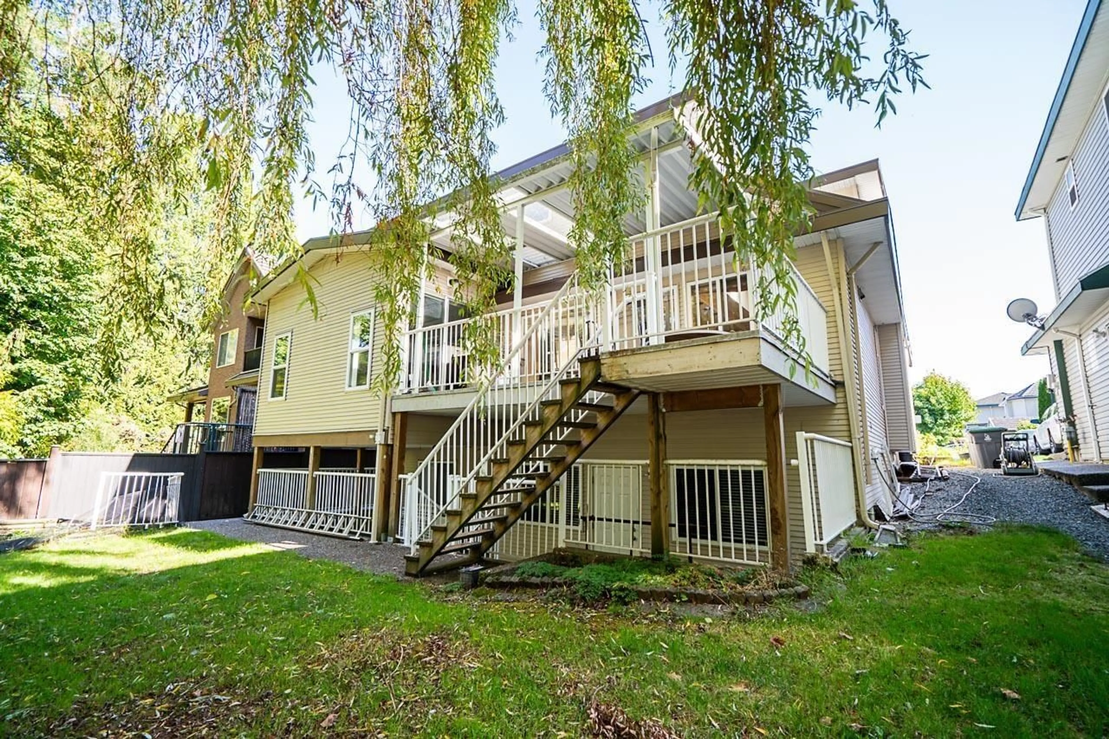 A pic from exterior of the house or condo, the fenced backyard for 7519 WILTSHIRE DRIVE DRIVE, Surrey British Columbia V3S2Y6