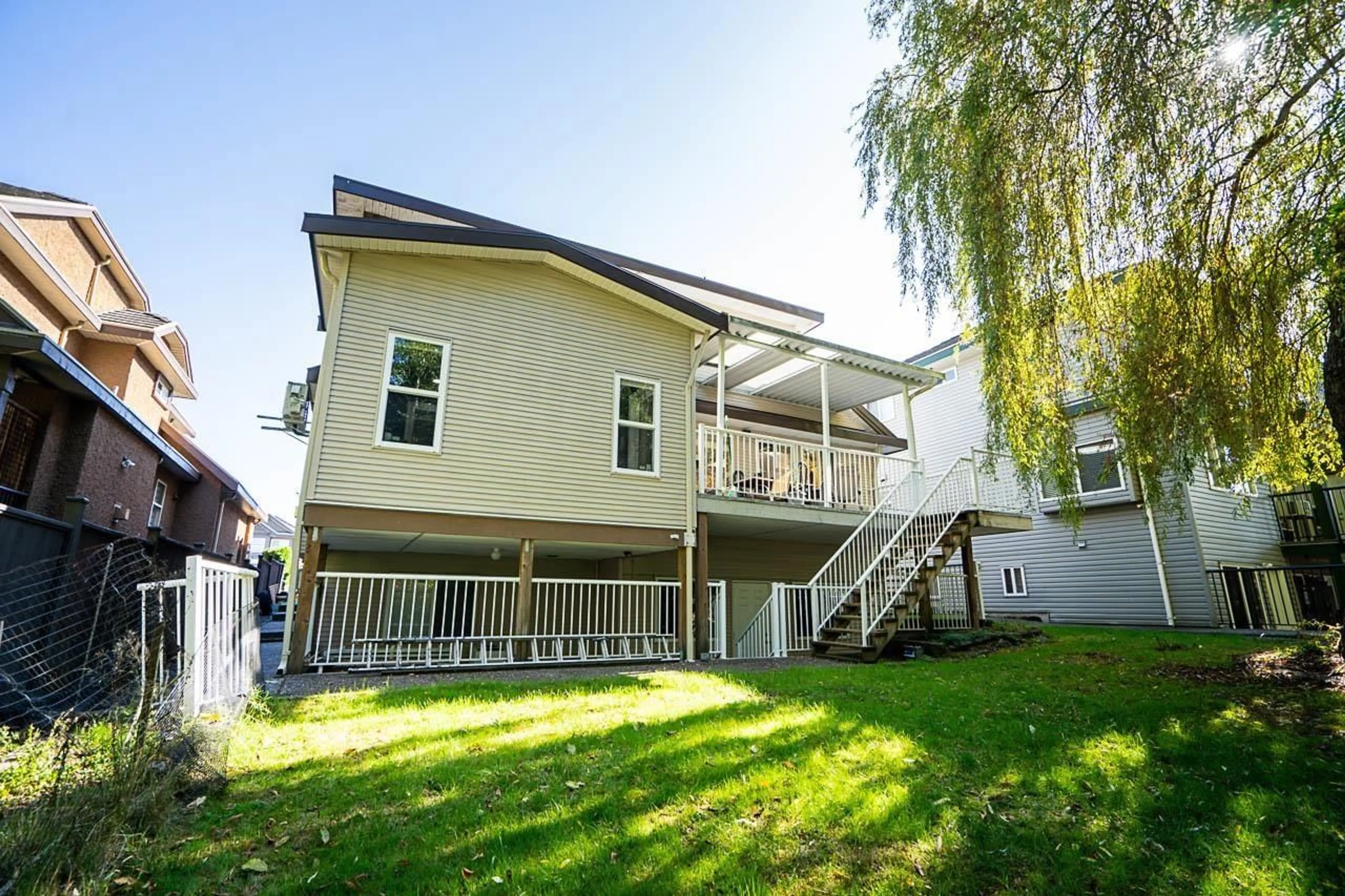 A pic from exterior of the house or condo, the fenced backyard for 7519 WILTSHIRE DRIVE DRIVE, Surrey British Columbia V3S2Y6