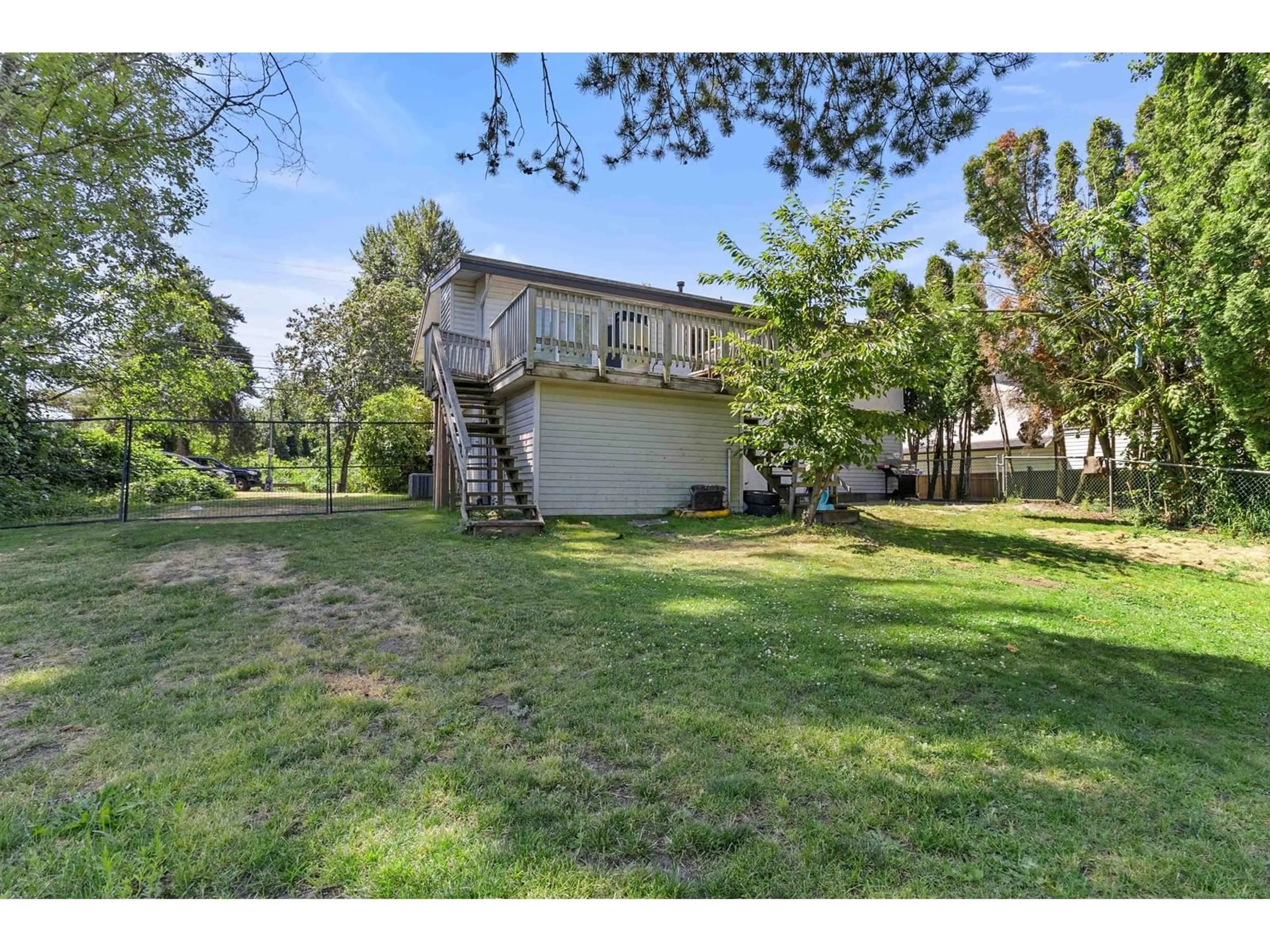 A pic from exterior of the house or condo, the fenced backyard for 31745 CHARLOTTE AVENUE, Abbotsford British Columbia V2T3Z6