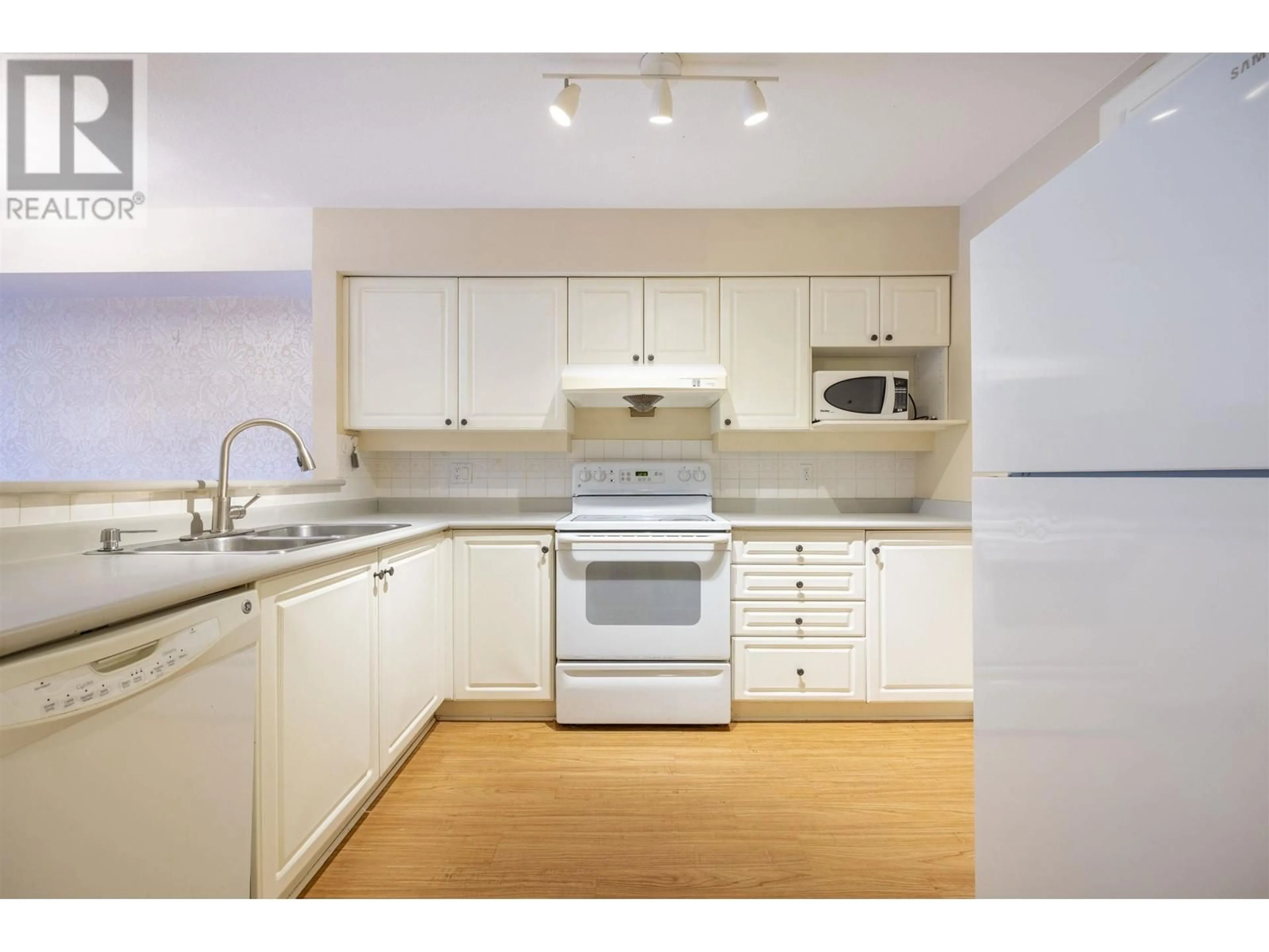 Standard kitchen, wood floors for 301B 7025 STRIDE AVENUE, Burnaby British Columbia V3N4Y2