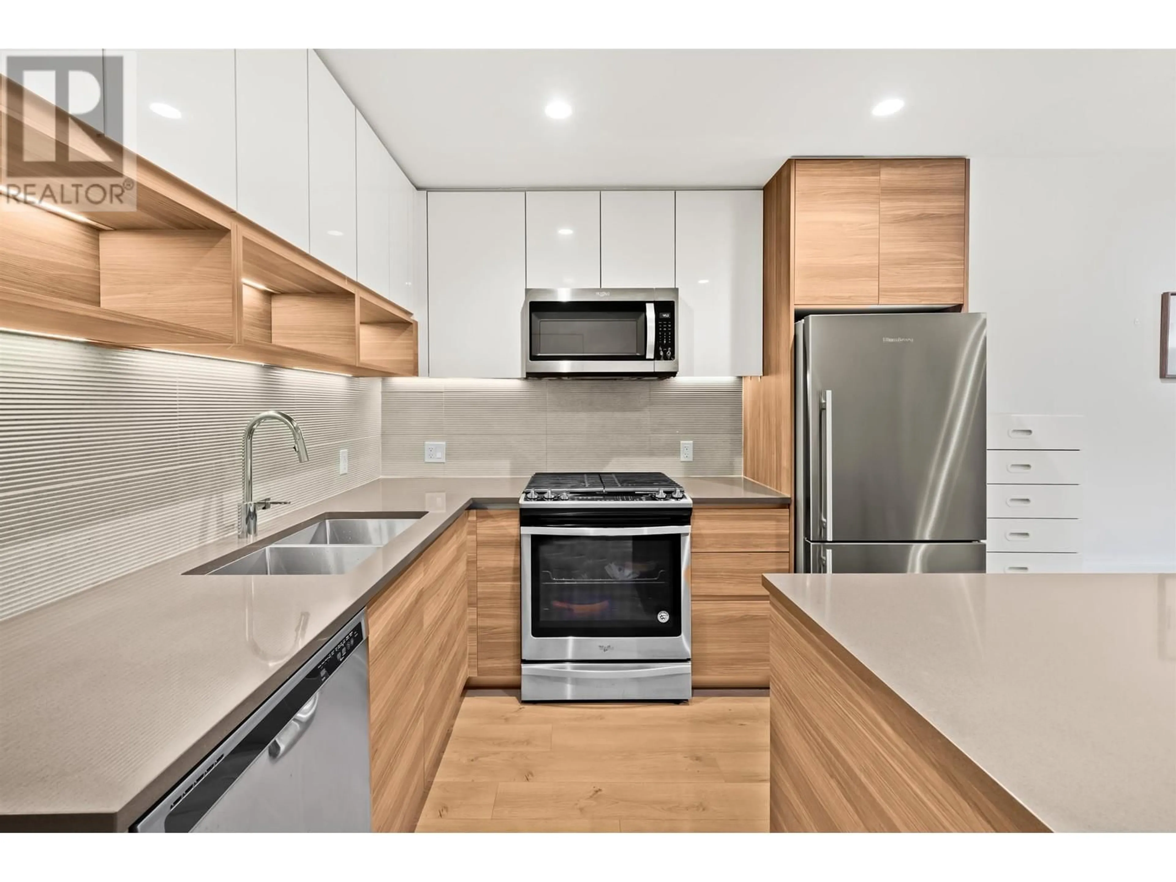 Standard kitchen, wood floors for 207 8850 UNIVERSITY CRESCENT, Burnaby British Columbia V5A0C8