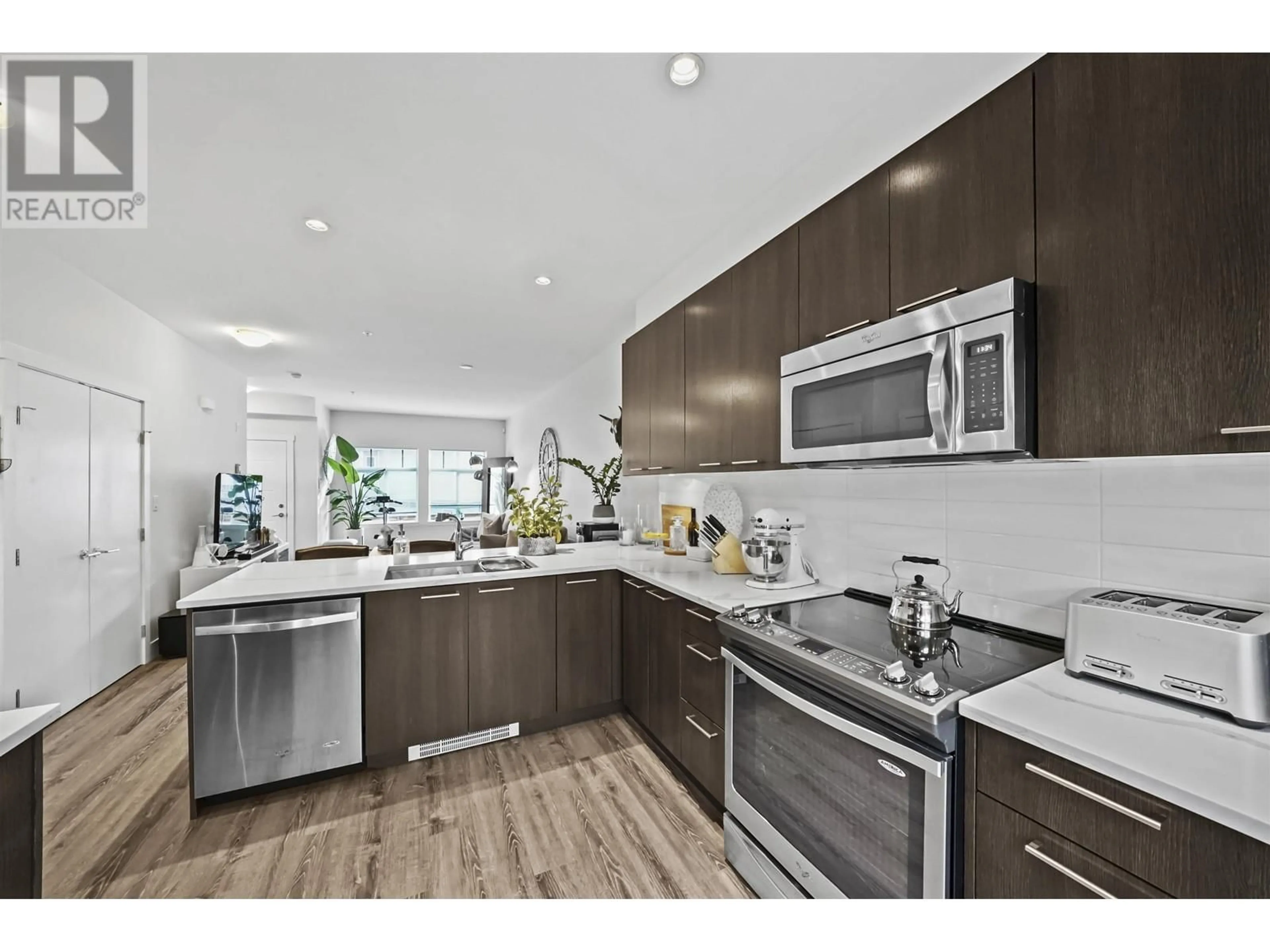 Open concept kitchen for 210 7180 BARNET ROAD, Burnaby British Columbia V5A1C8