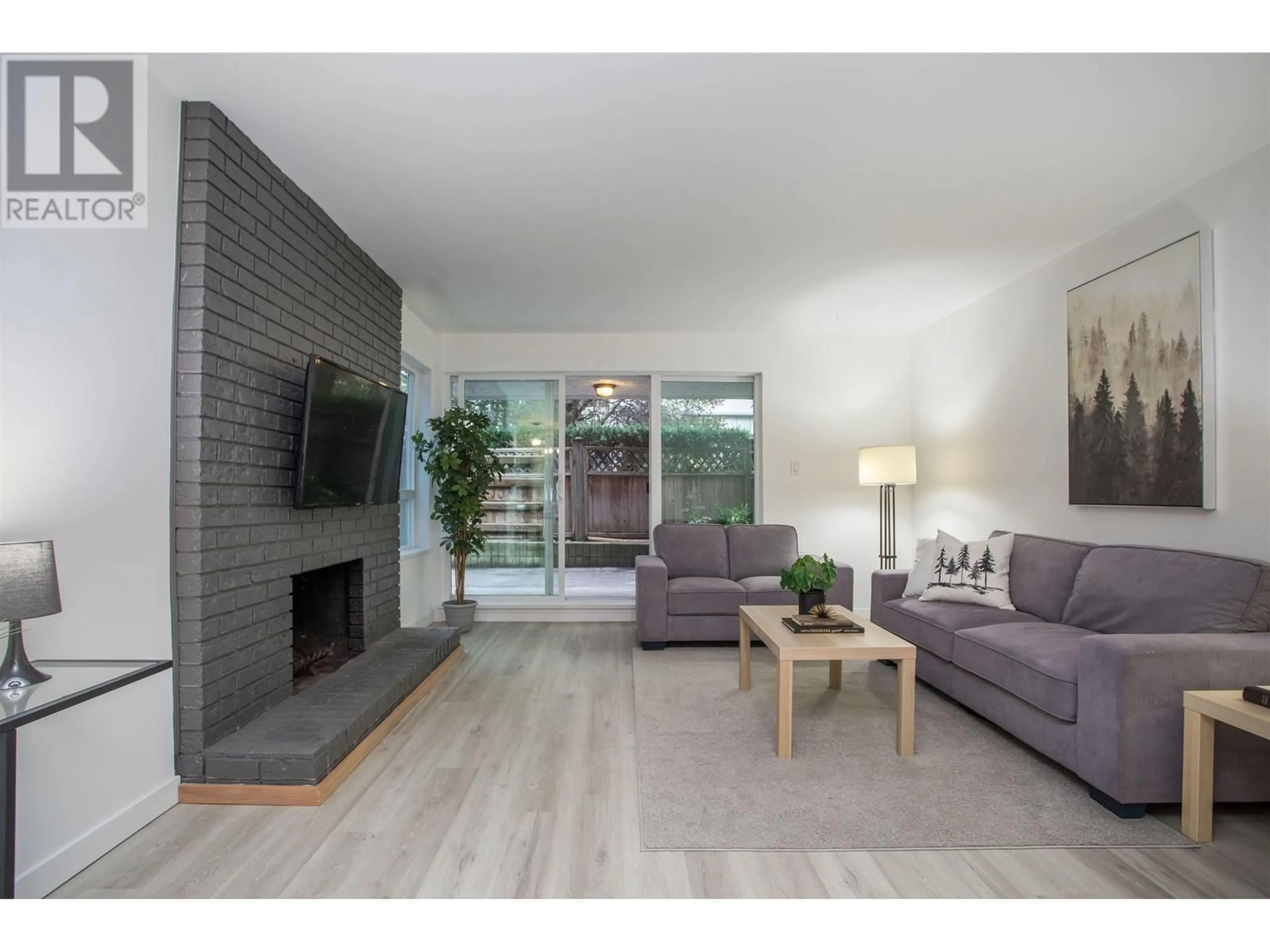 Living room, wood floors for 102 1234 PENDRELL STREET, Vancouver British Columbia V6E1L6