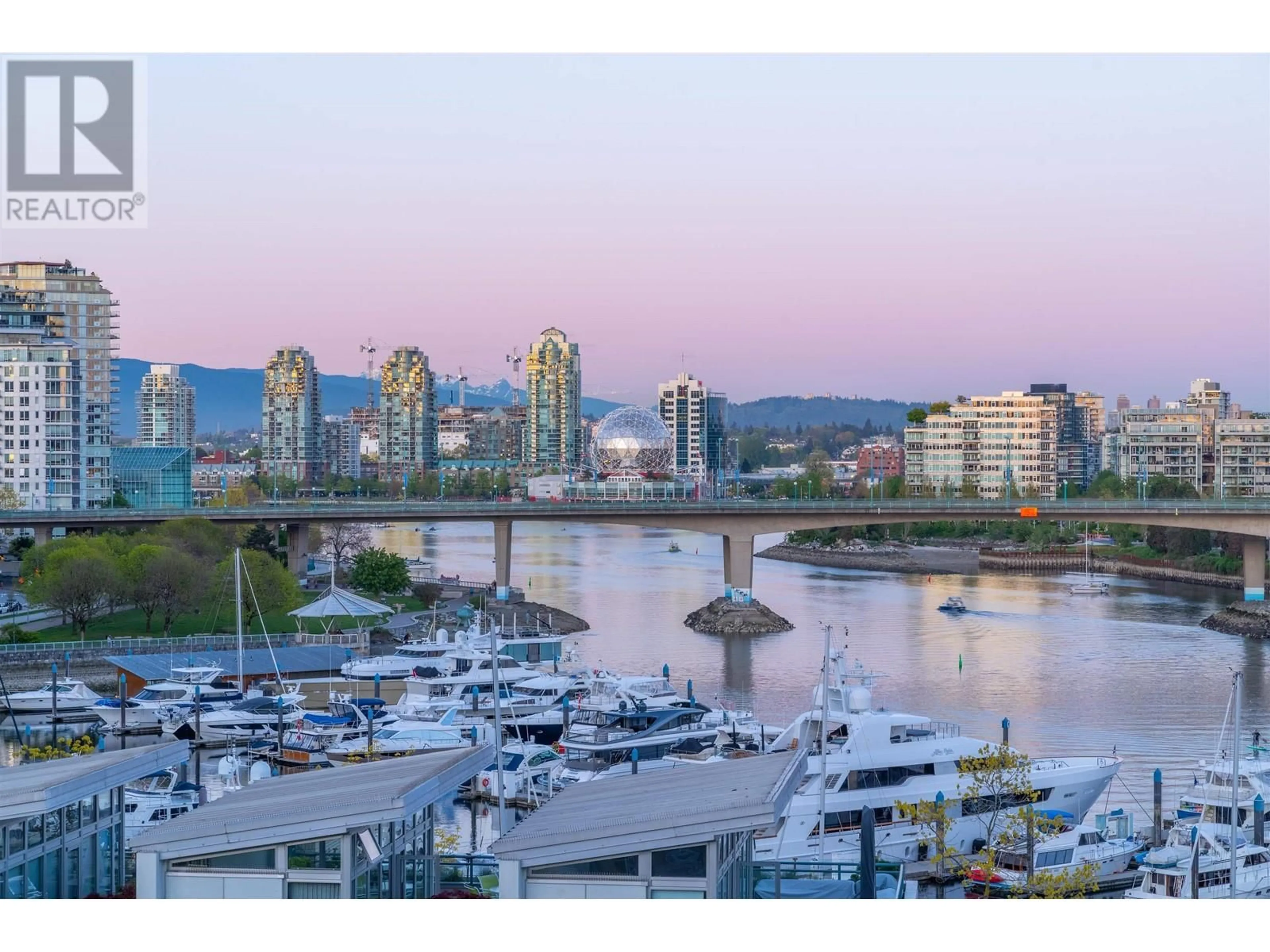 A pic from exterior of the house or condo, the view of city buildings for 906 1288 MARINASIDE CRESCENT, Vancouver British Columbia V6Z2W5