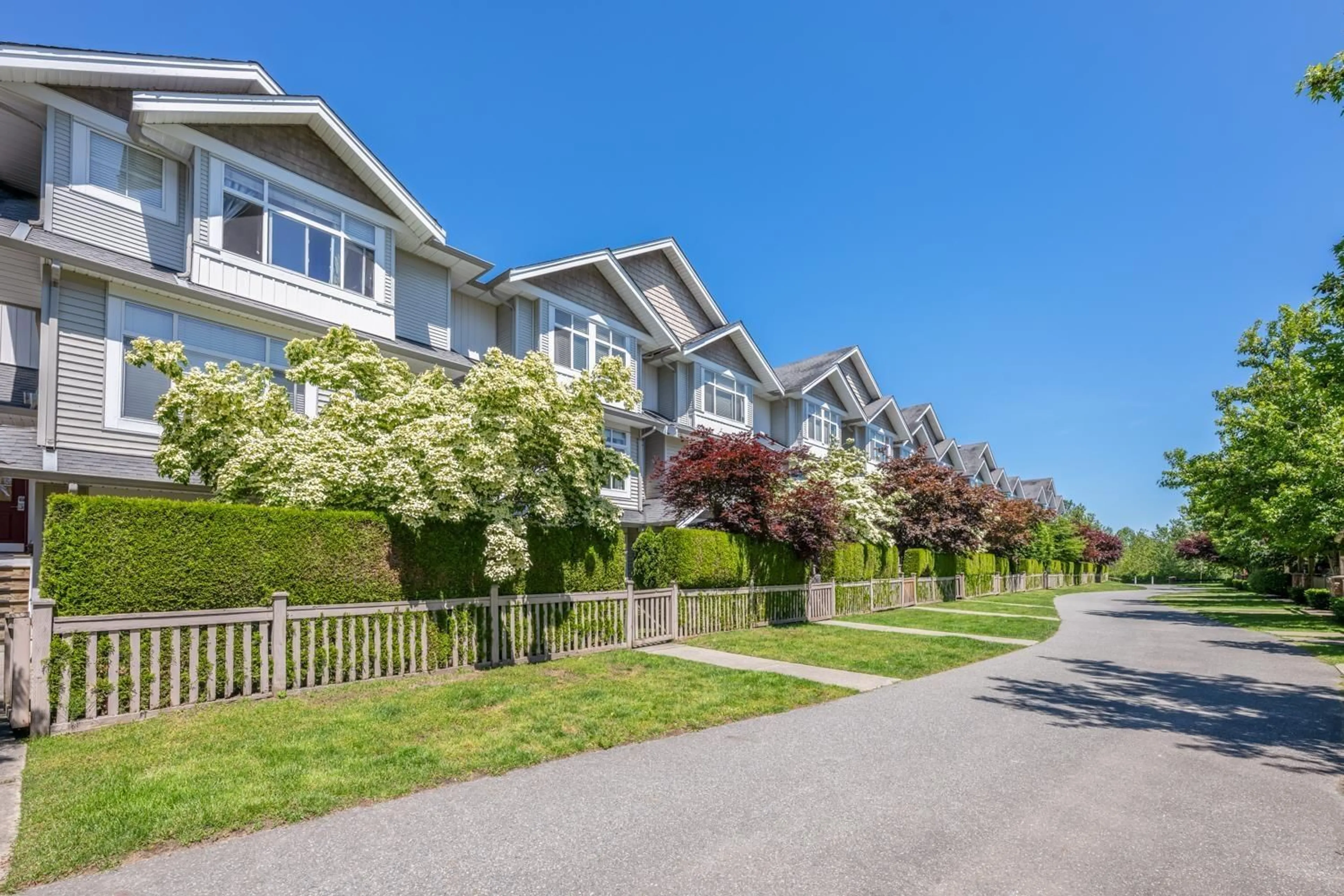 A pic from exterior of the house or condo, the fenced backyard for 35 19330 69 AVENUE, Surrey British Columbia V4N0Z2