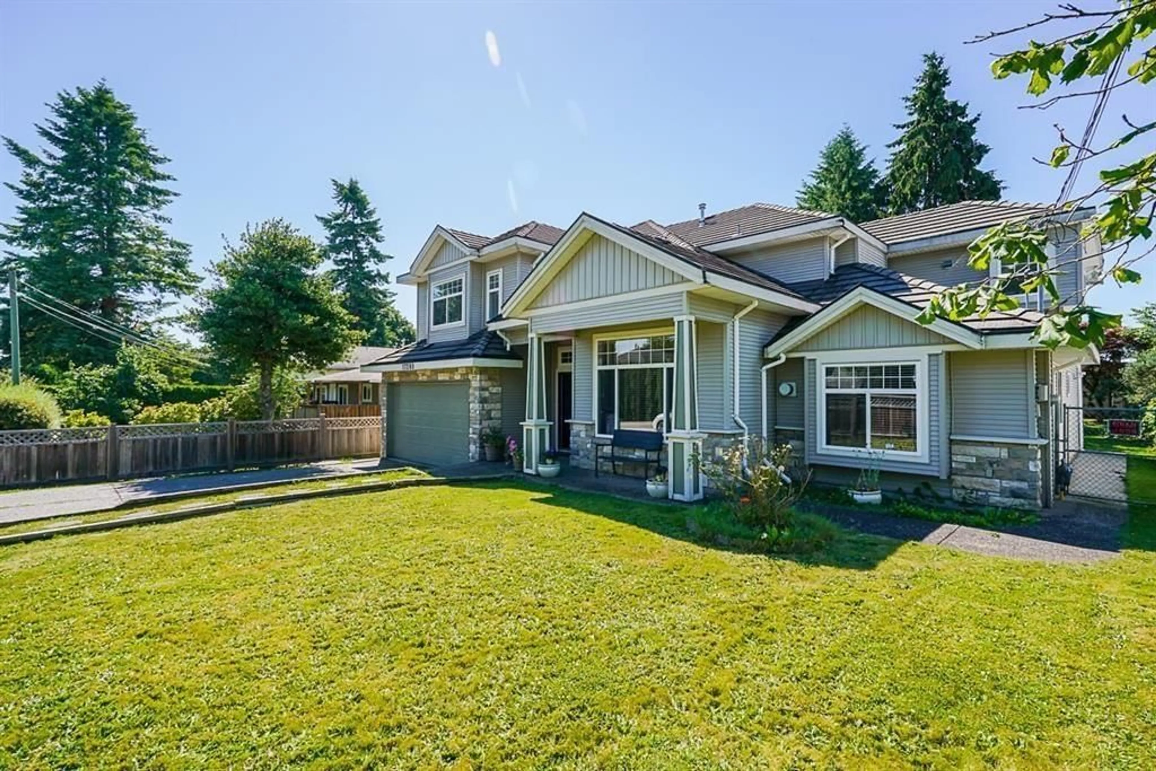 Frontside or backside of a home, the fenced backyard for 17280 60 AVENUE, Surrey British Columbia V3S1T6