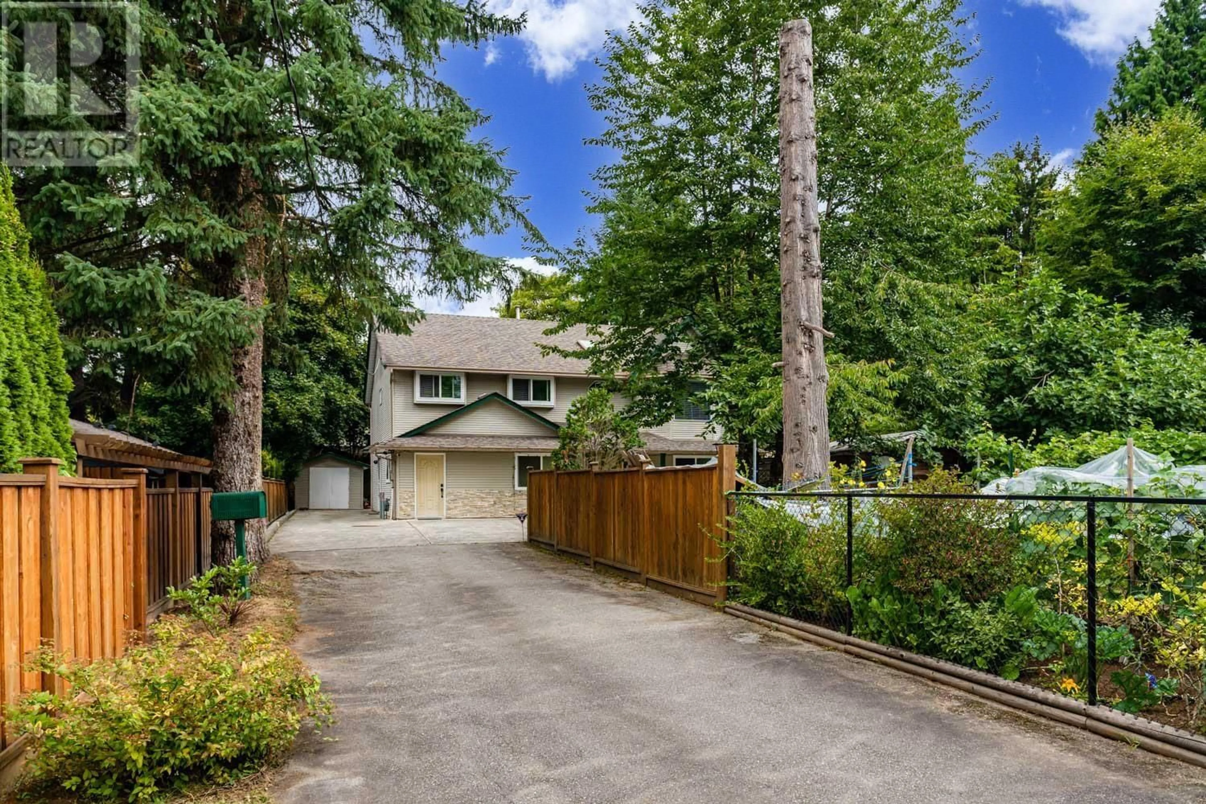 A pic from exterior of the house or condo, the fenced backyard for 21209 DEWDNEY TRUNK ROAD, Maple Ridge British Columbia V2X3G1