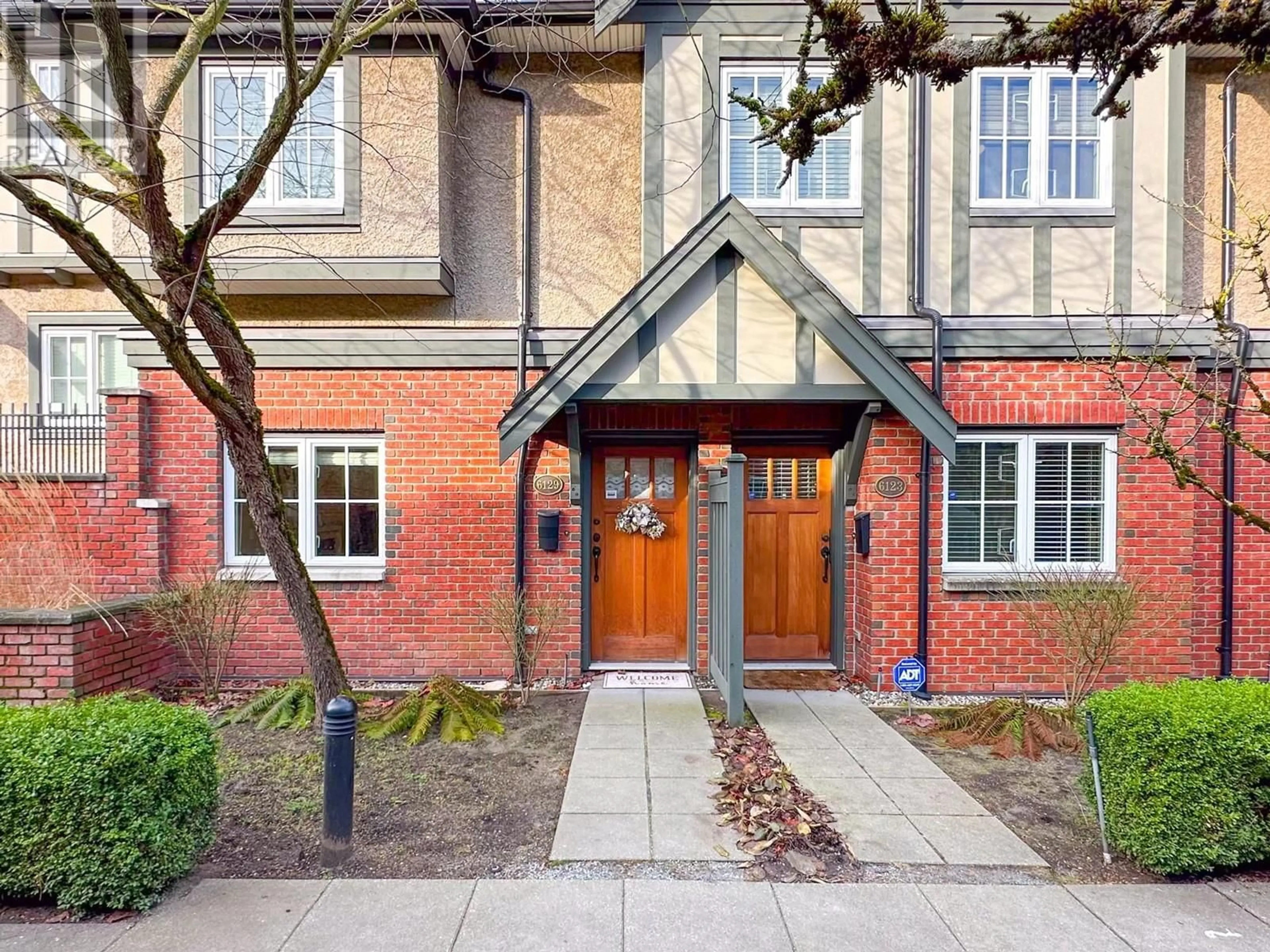 Home with brick exterior material for 6129 OAK STREET, Vancouver British Columbia V6M2W3