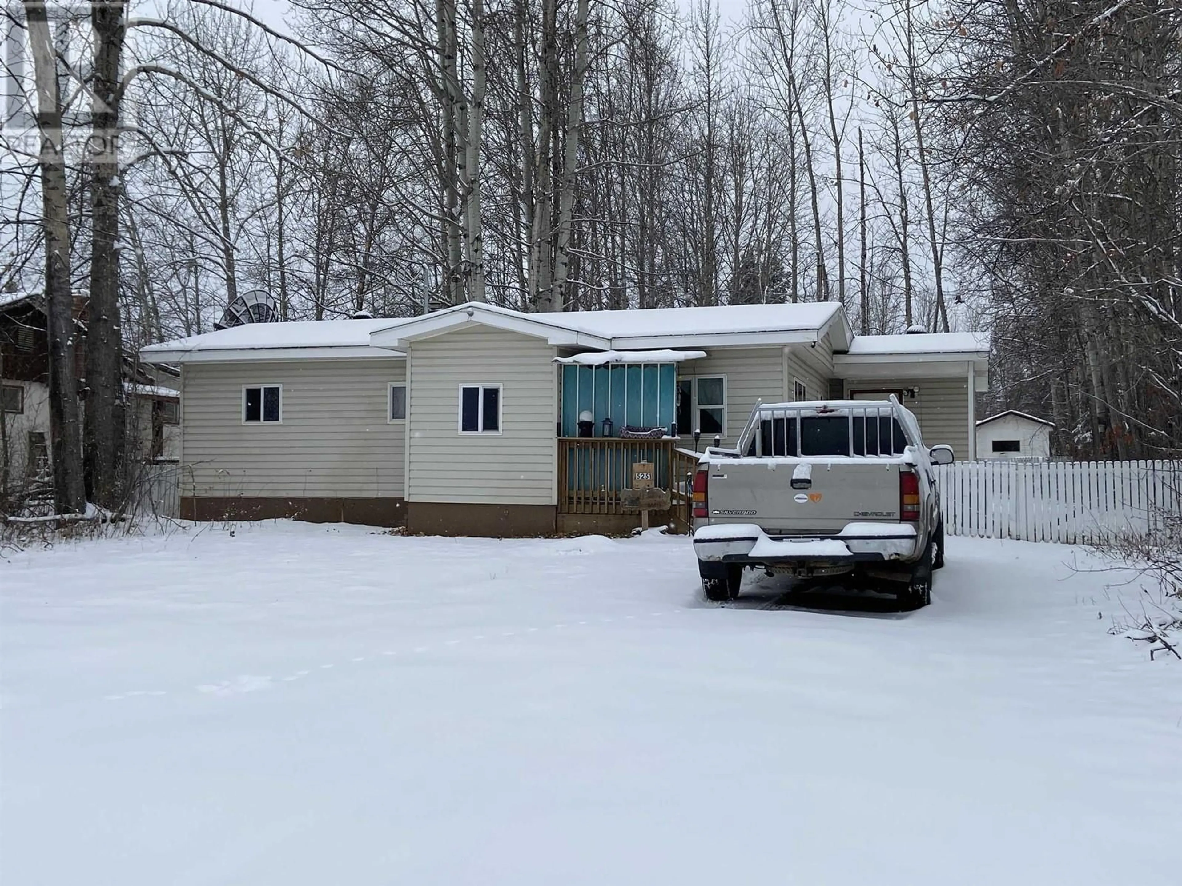 Home with vinyl exterior material, street for 5251 42 STREET, Fort Nelson British Columbia V0C1R0