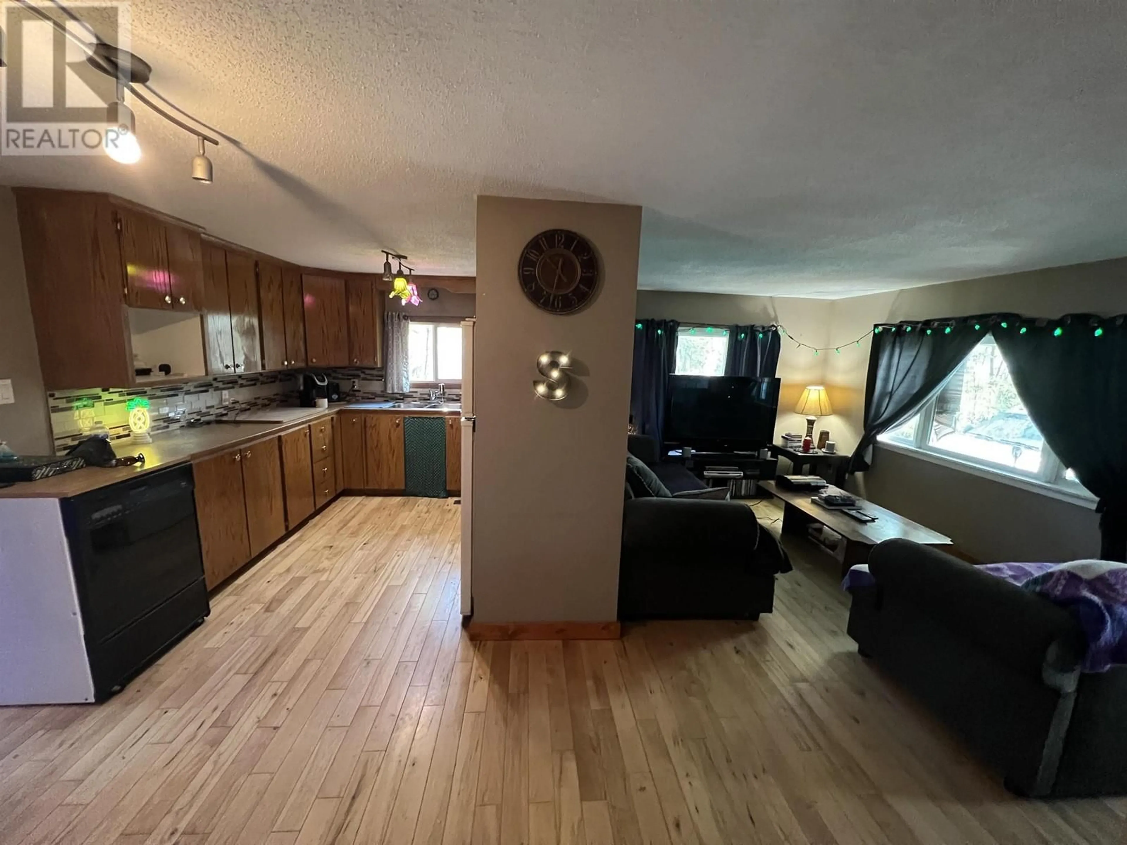 Open concept kitchen, wood/laminate floor for 5251 42 STREET, Fort Nelson British Columbia V0C1R0