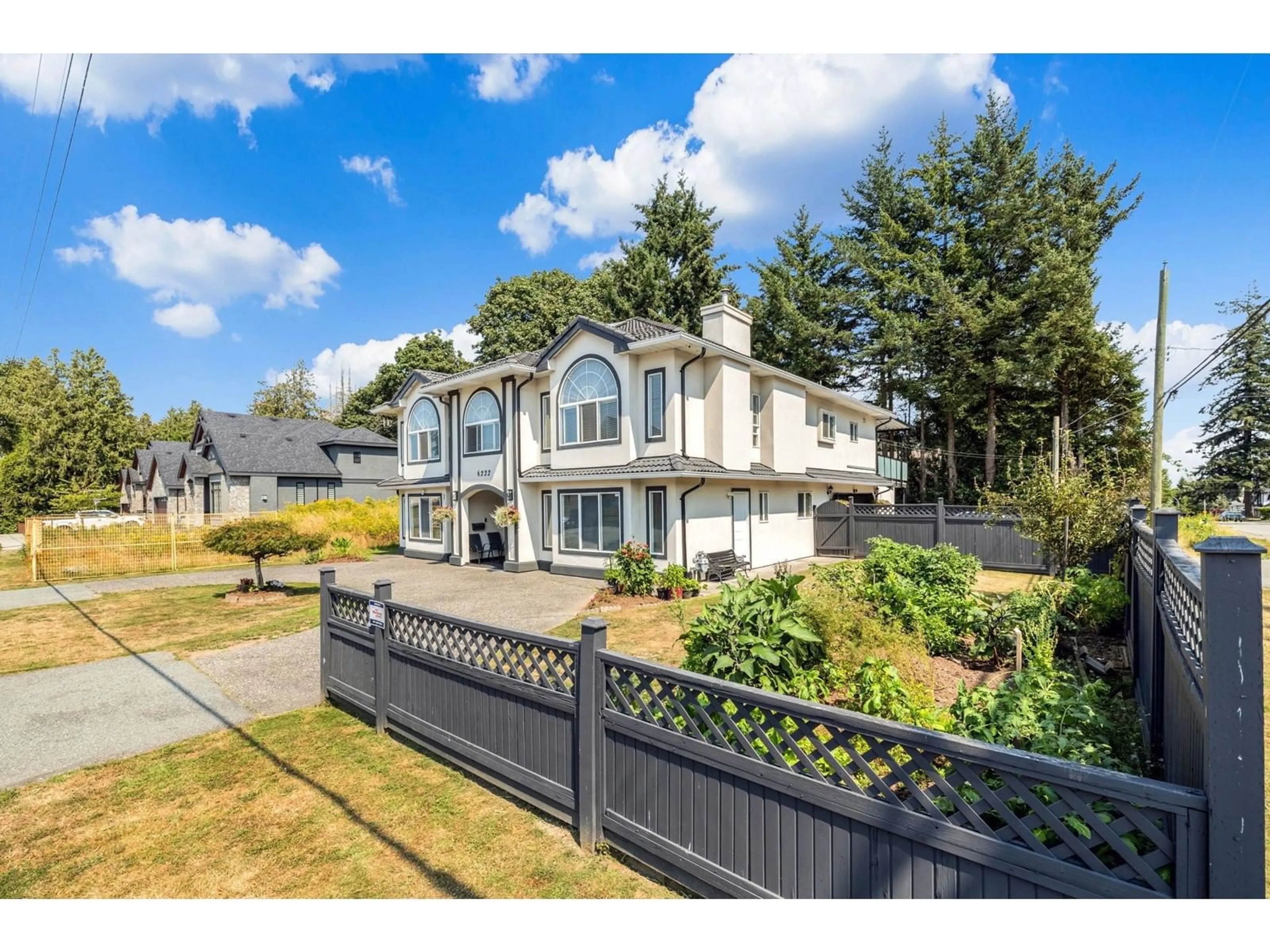 Frontside or backside of a home, the fenced backyard for 6222 133 STREET, Surrey British Columbia V3X1M2