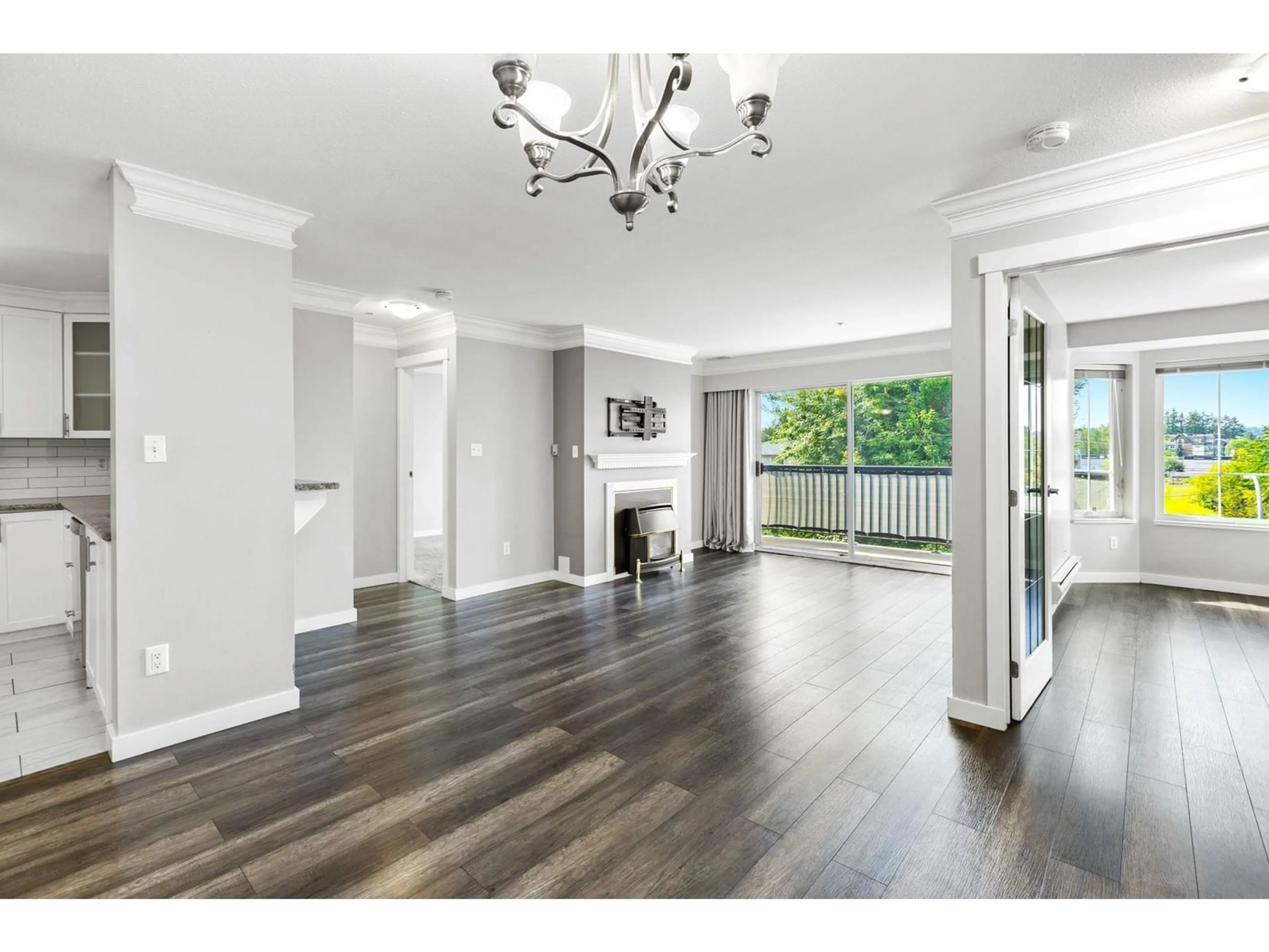 A pic of a room, wood floors for 302 20881 56 AVENUE, Langley British Columbia V3A3Z3