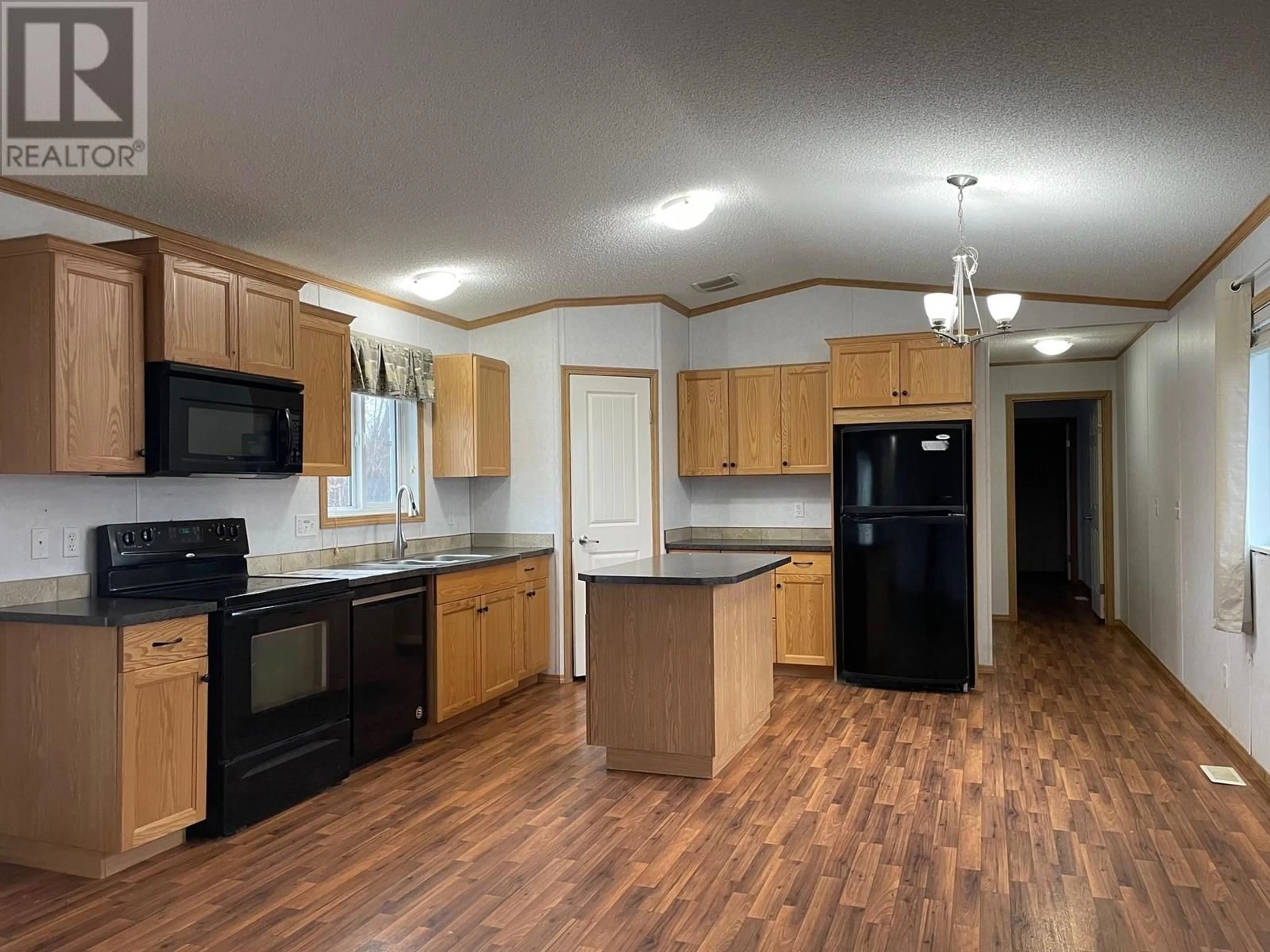 Open concept kitchen for 5332 42 STREET, Fort Nelson British Columbia V0C1R0