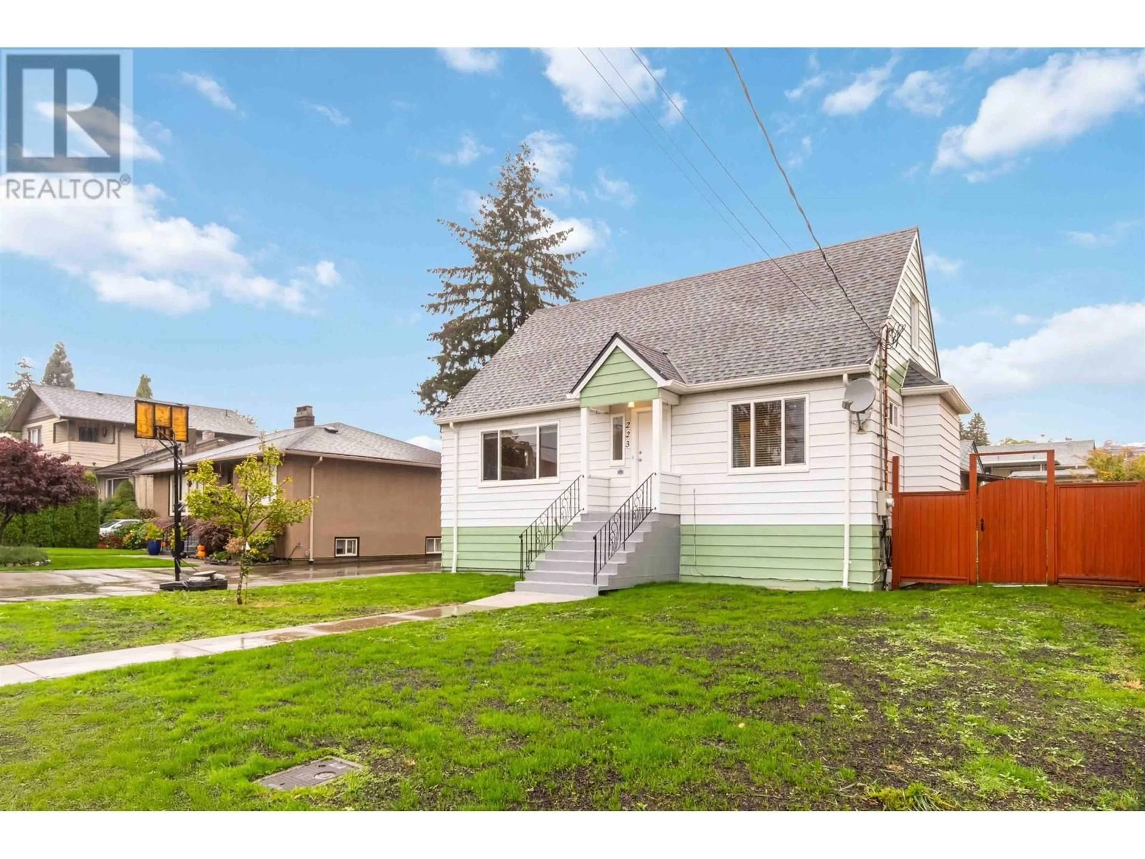 Frontside or backside of a home, the fenced backyard for 223 NINTH AVENUE, New Westminster British Columbia V3L2A2