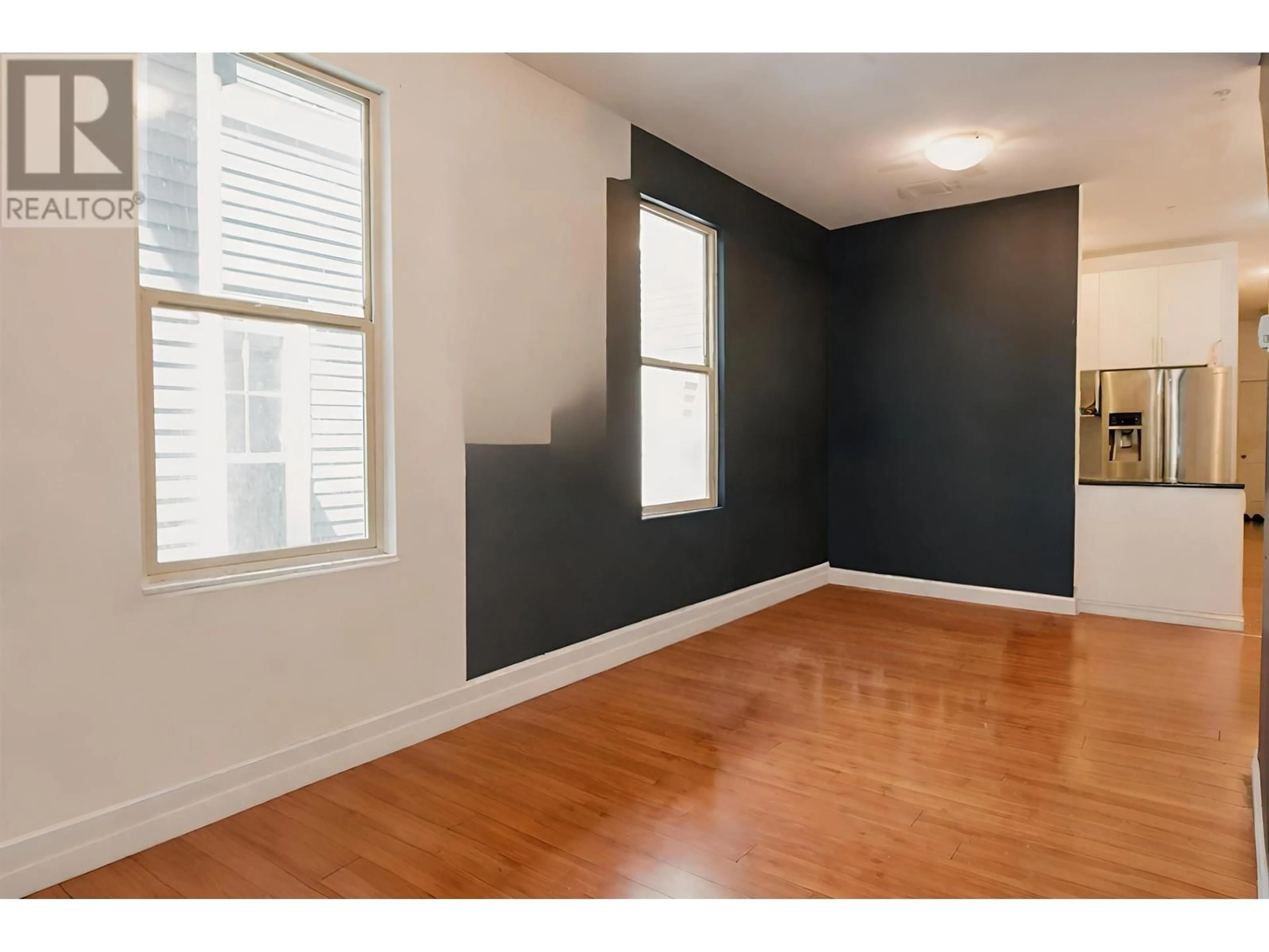 A pic of a room, wood floors for 923-925 E BROADWAY, Vancouver British Columbia V5T1Y3