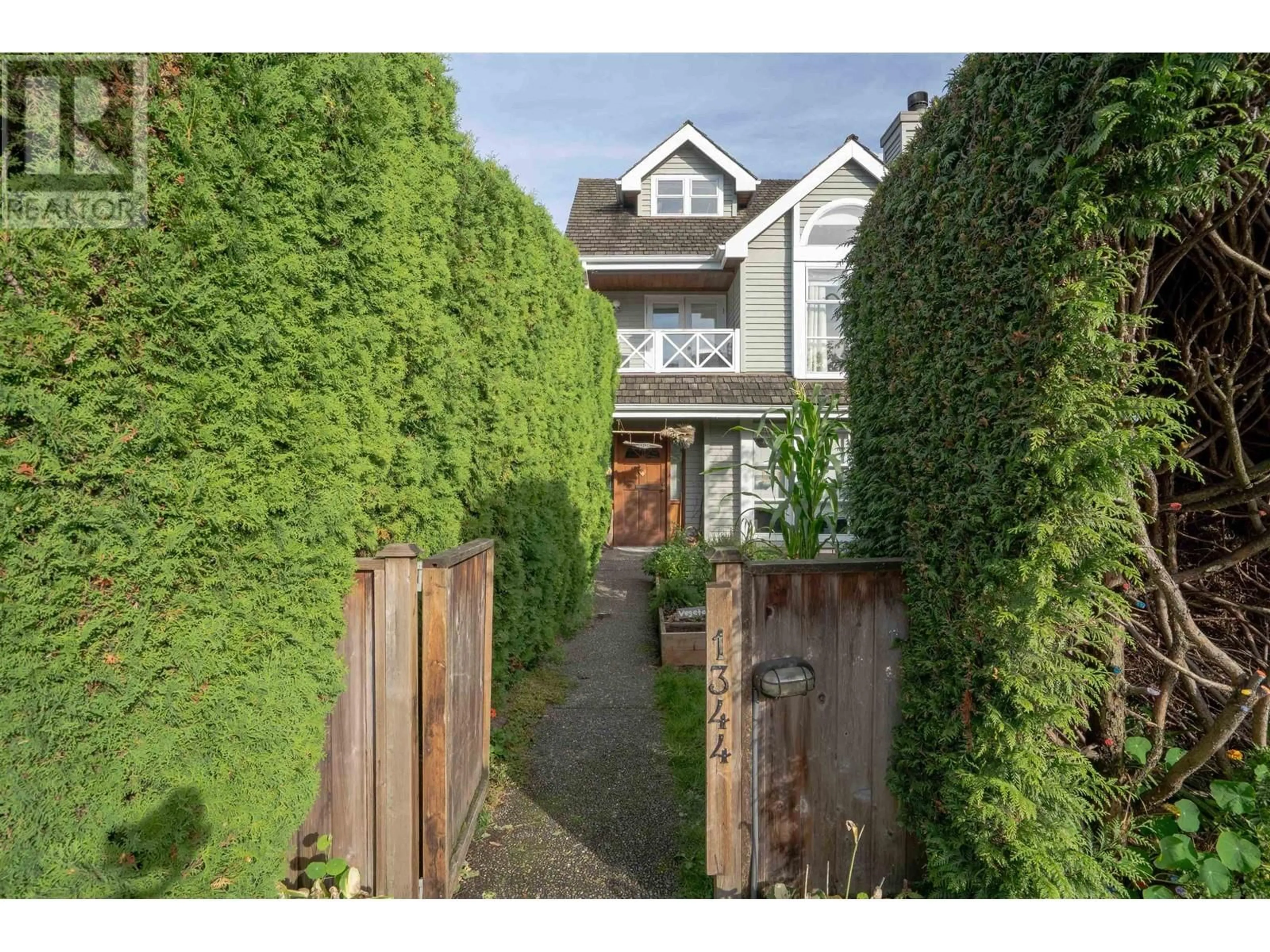 Frontside or backside of a home, the fenced backyard for 1344 LABURNUM STREET, Vancouver British Columbia V6J3W3