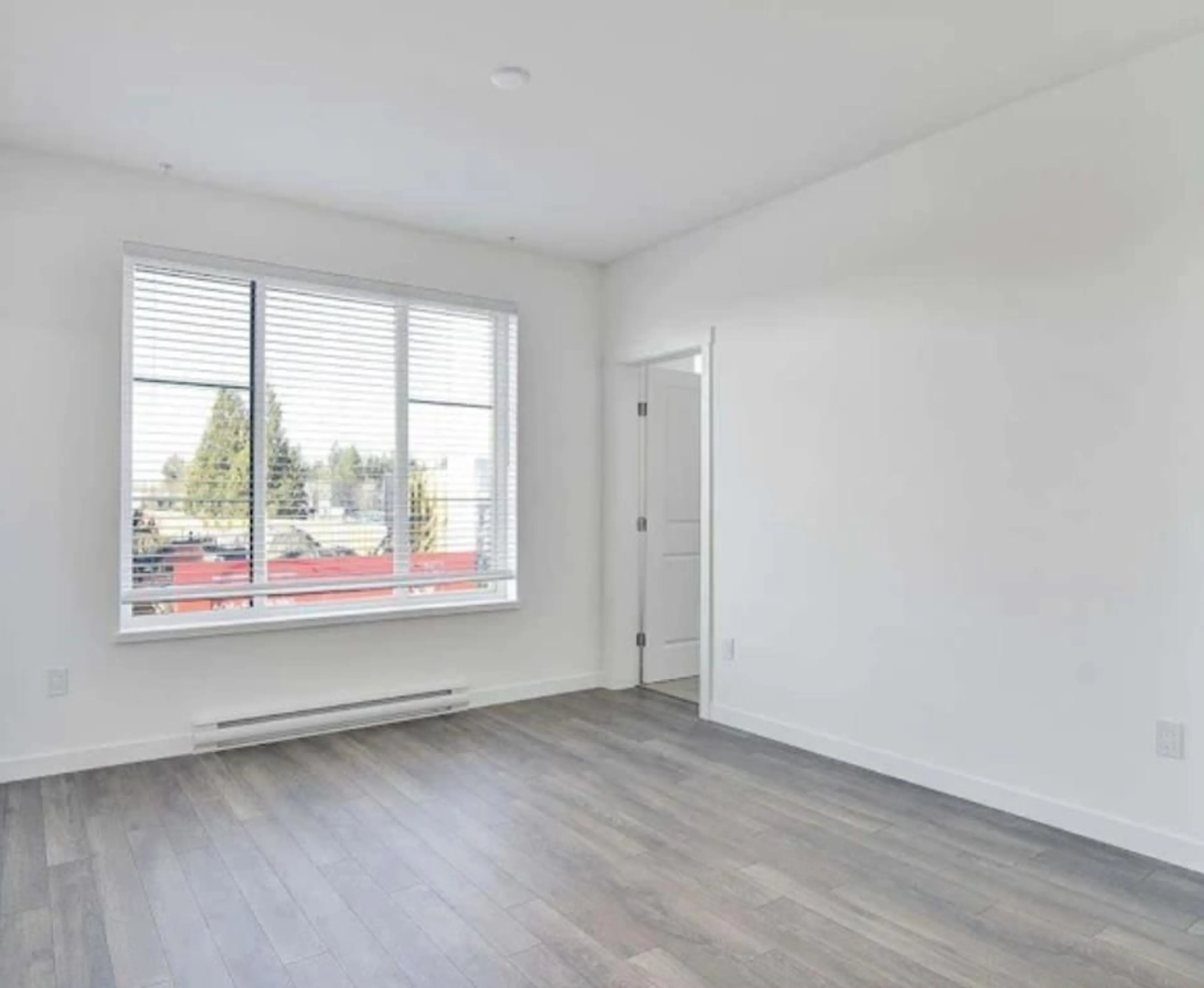 A pic of a room, wood floors for 402 15848 FRASER HIGHWAY, Surrey British Columbia V4N6X6